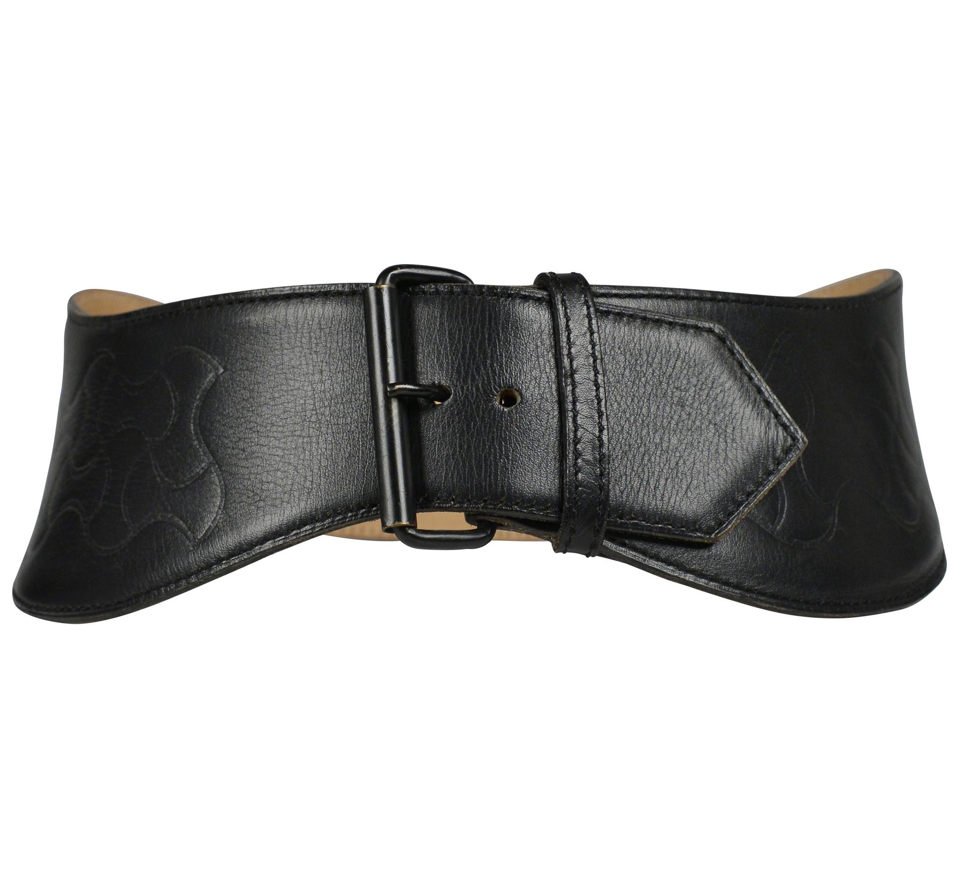 Resurrection Vintage is excited to offer a vintage black leather Azzedine Alaia wide waist belt featuring embossed detailing, a leather-covered buckle, and a dramatic curved shape. The belt has additional holes to adjust the size. 

Alaia Stamp
Size