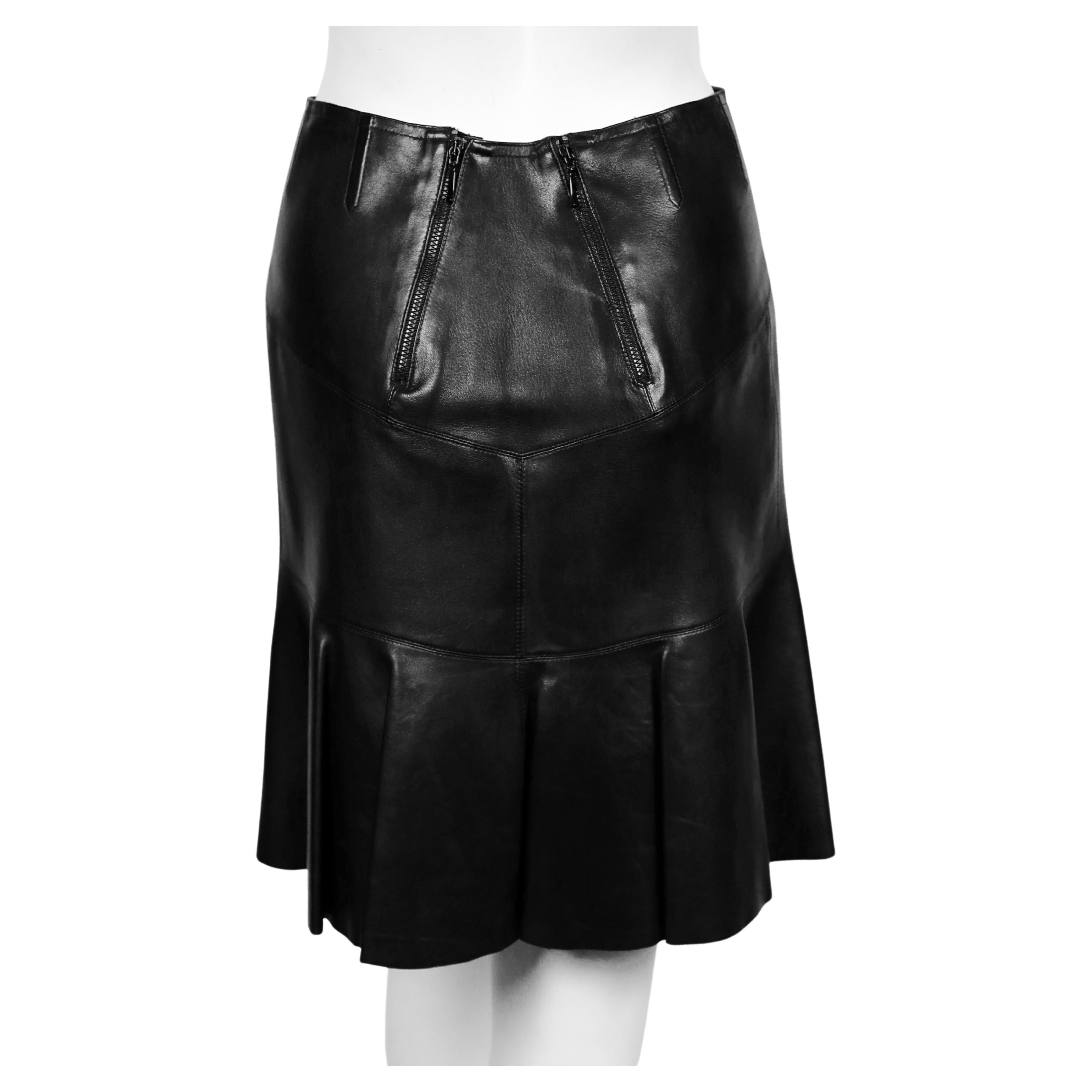 Women's or Men's AZZEDINE ALAIA black leather skirt with pleated hemline For Sale