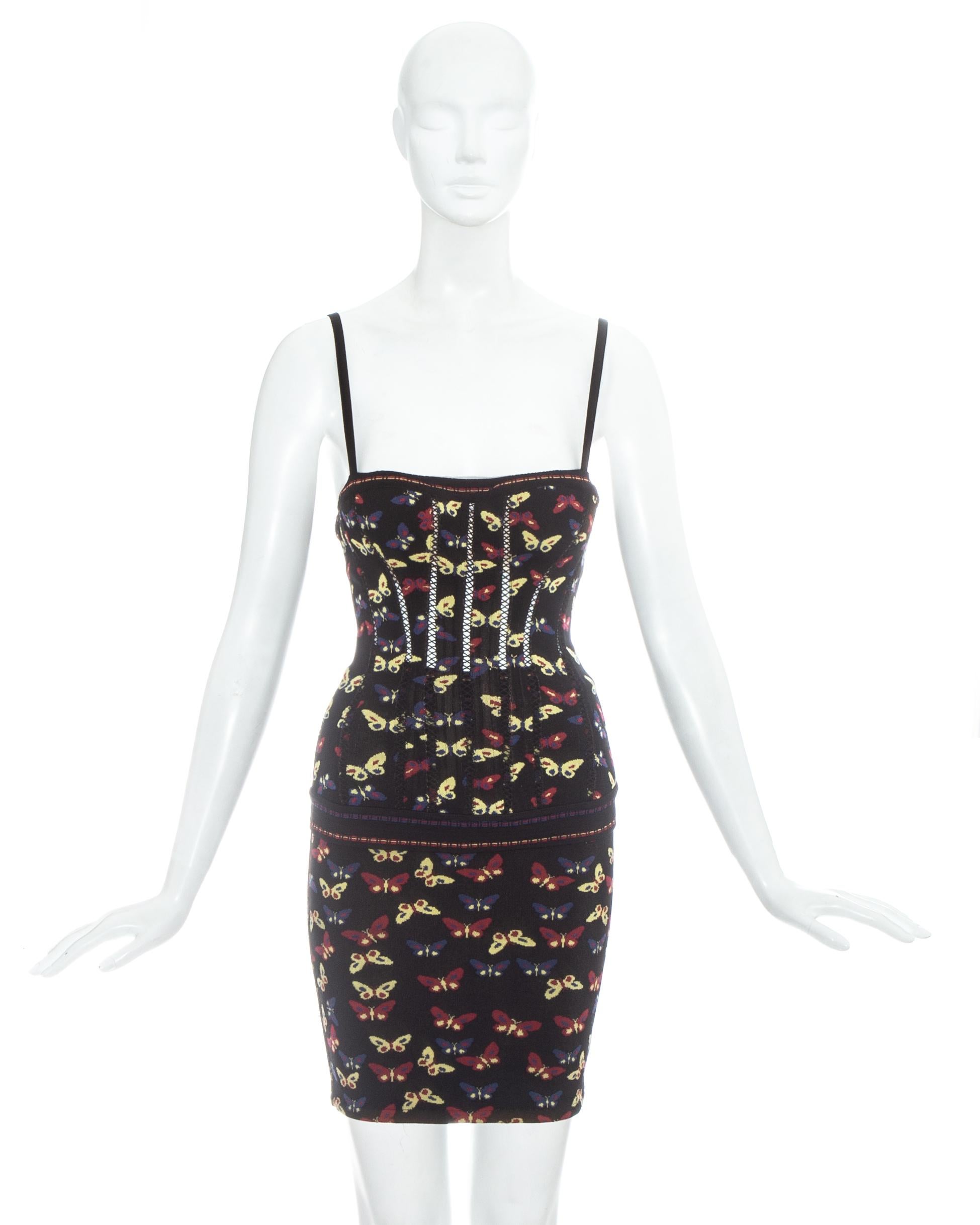 Azzedine Alaia iconic butterfly printed corset and skirt ensemble. Corset with cut outs, zip fastening and built in padded bra; paired with fitted pencil skirt.

Fall-Winter 1991
