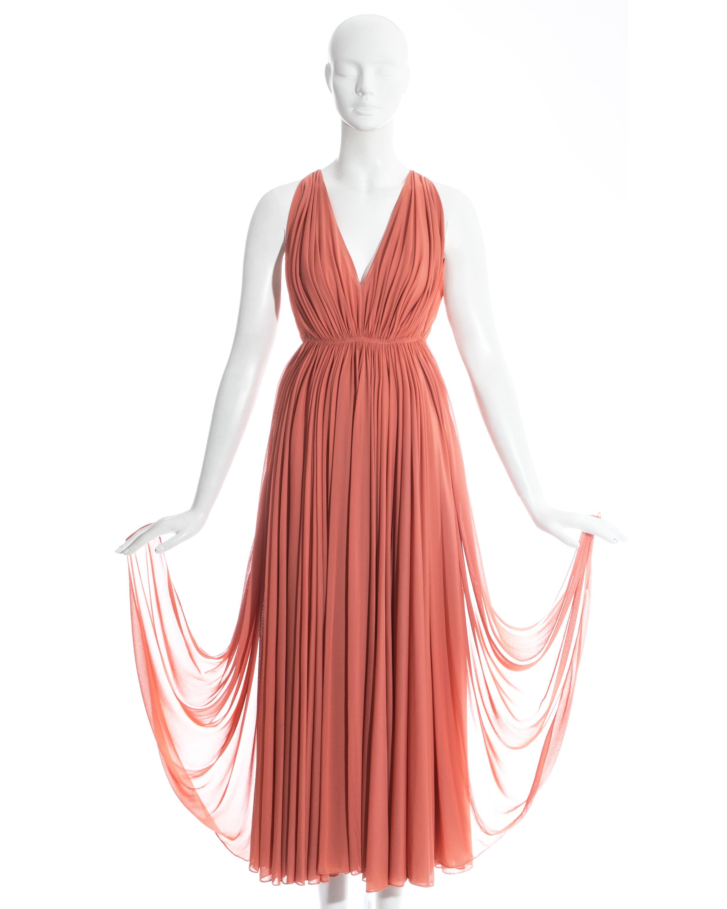 Azzedine Alaia coral jersey Grecian evening dress. Intricate pleating on the skirt and bust formed at the waistband. 6 High leg slits. Hook and eye fastening at the center back. 

Spring-Summer 1991

* This dress would be best fitted on a petite