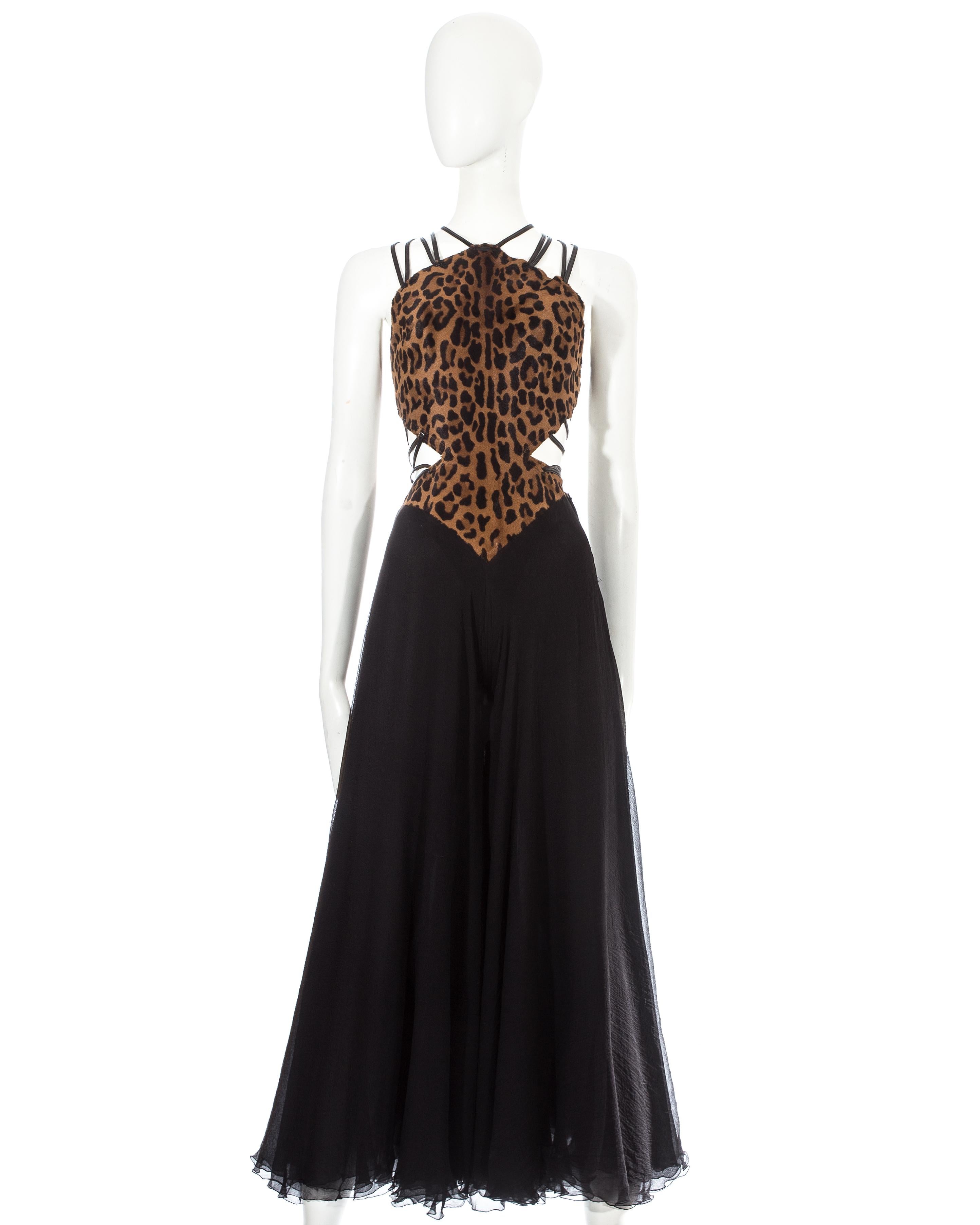 Azzedine Alaia Couture 

- Hand made by Azzedine Alaia 
- Leopard pony hair bodice with built in bodysuit 
- Black leather straps fastened with hook and eye closures 
- Double layered black silk chiffon wide leg pants 
- Built in padded bra 
-