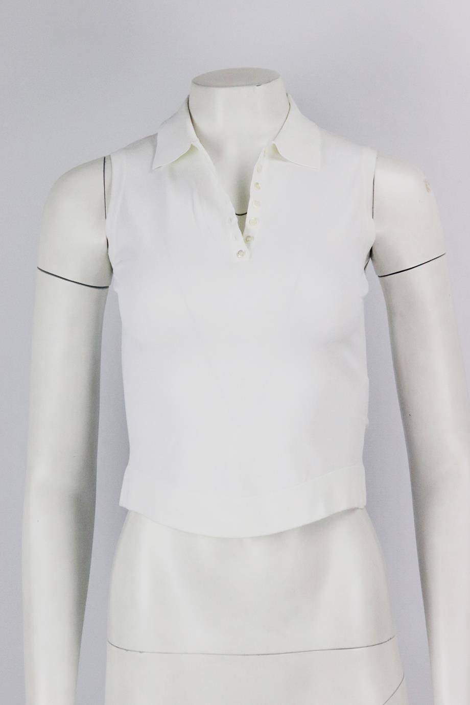 Azzedine Alaïa cropped stretch knit top. White. Sleeveless, crewneck. Slips on. 83% Viscose, 17% polyester. Size: FR 36 (UK 8, US 4, IT 40). Bust: 29 in. Waist: 26.4 in. Hips: 27.2 in. Length: 16.75. Very good condition - Light signs of wear; see
