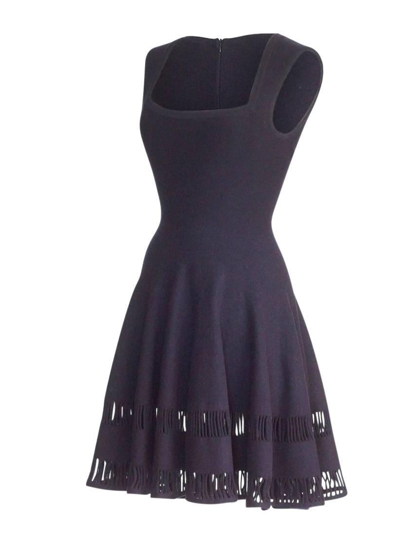 No one designed for the shape of a womans body like the master Azzedine Alaia.  Gone far too young the world of fashion will miss him.
Guaranteed authentic Azzedine Alaia  dark navy squared scoop neck dress with the iconic Alaia fit. 
Flare full