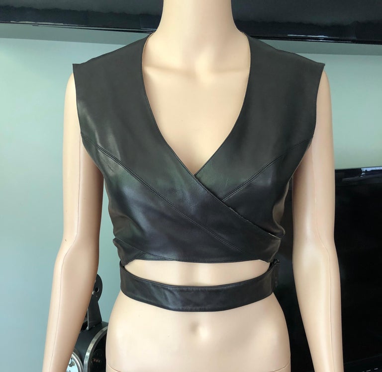 Azzedine Alaia F/W 1983 Vintage Leather Cutout Wrap Top FR 40

Azzedine Alaia vintage leather wrap bra top featuring wraparound design, belted at the waist for an adjustable fit.

All Eyes on Alaïa

For the last half-century, the world’s most