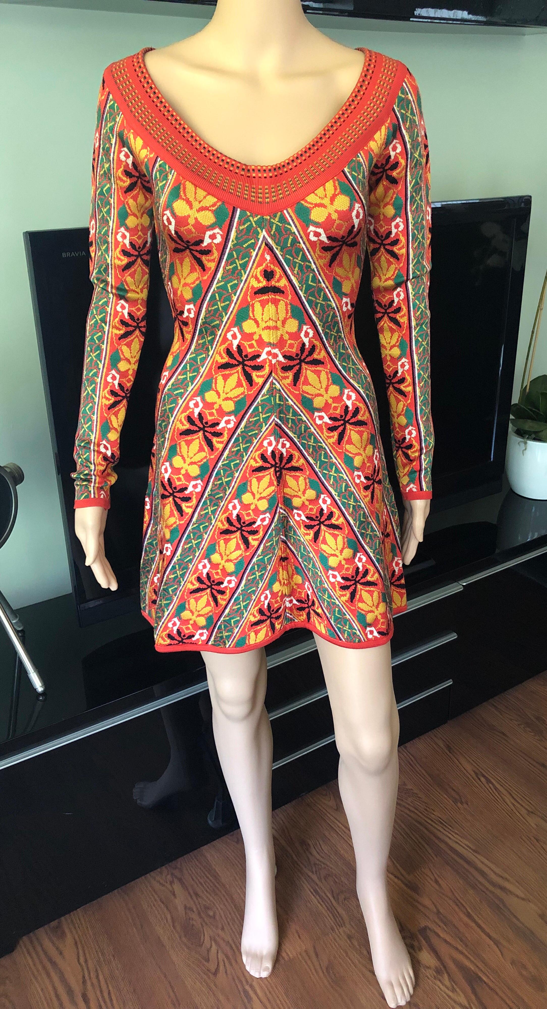Azzedine Alaia F/W 1990 Vintage Abstract Floral Print Knit Dress Size M

Orange and multicolor vintage Alaia long sleeve mini heavy knit dress with abstract print throughout and scoop neckline.
