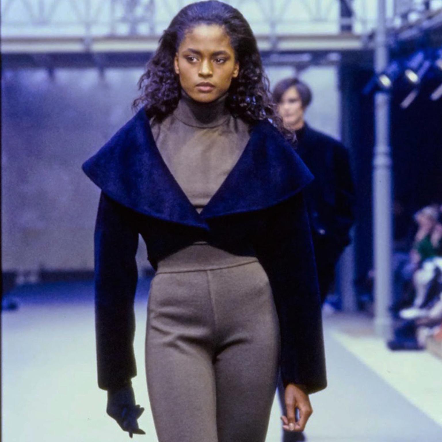 This Alaia vintage cropped black lamb velvety suede jacket was featured on the Fall 1989 Alaia runway in a range of colors. Alaia jackets are so perfect to have in your closet to add instant style and interest to anything you wear them with! This