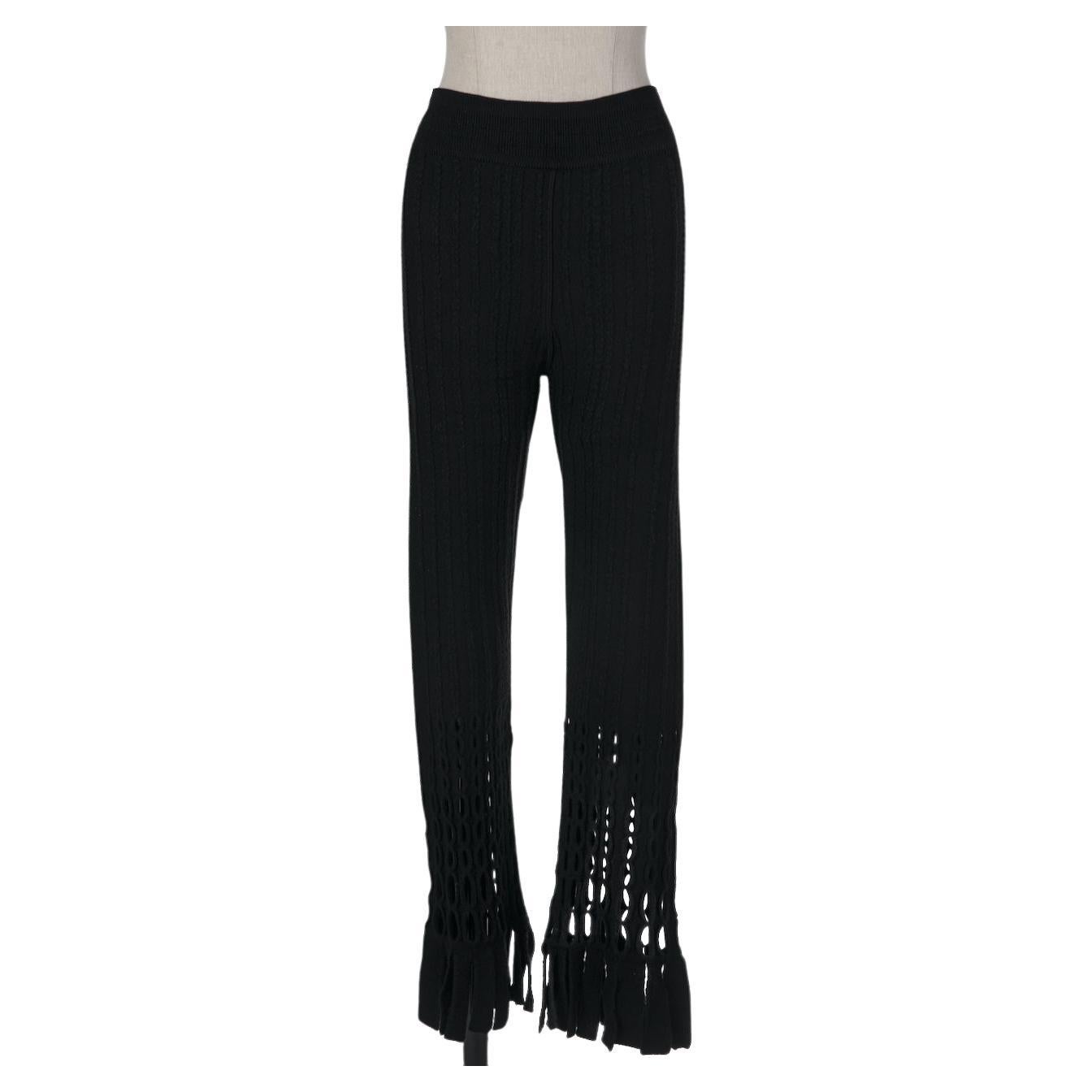 Here we have a truly important and documented piece of fashion history by AZZEDINE ALAÏA from his Fall 1993 collection: the black perforated boiled wool-blend pants with fringed finishings. They were worn by super model Nadja Auermann for an