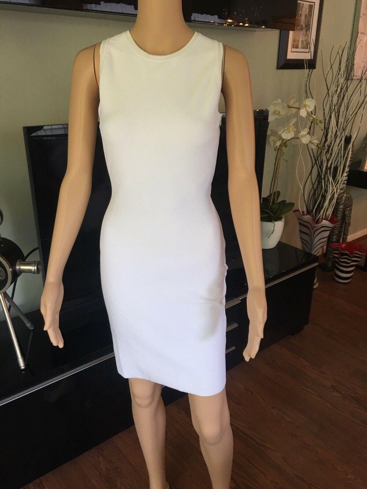 Azzedine Alaia Fitted Open Back Dress

White Alaïa sleeveless textured bodycon dress featuring scoop neckline, crossover straps at open back and concealed zip closure at side seam.

All Eyes on Alaïa

For the last half-century, the world’s most