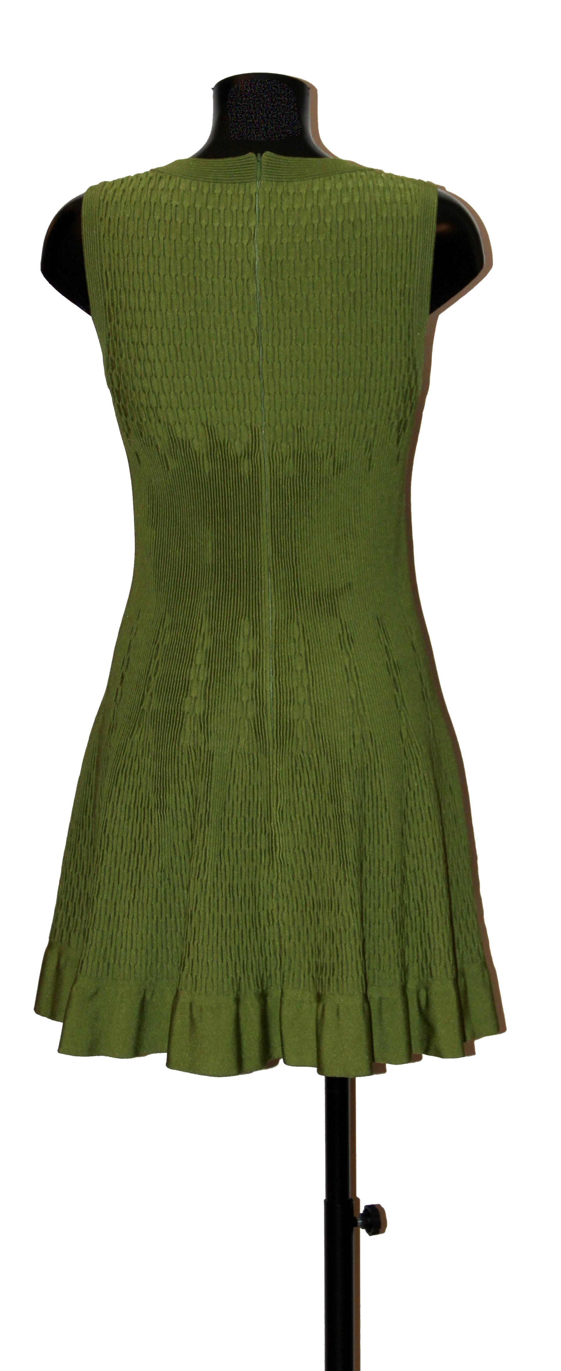 Azzedine Alaïa's great lines are so beutifully represented in this lovely flare dress.
It is crafted in a lime green knit mesh fabric.
The neckline is squared and the waist is tapered.
The length is to the knee and the dress is finished by a ruffle