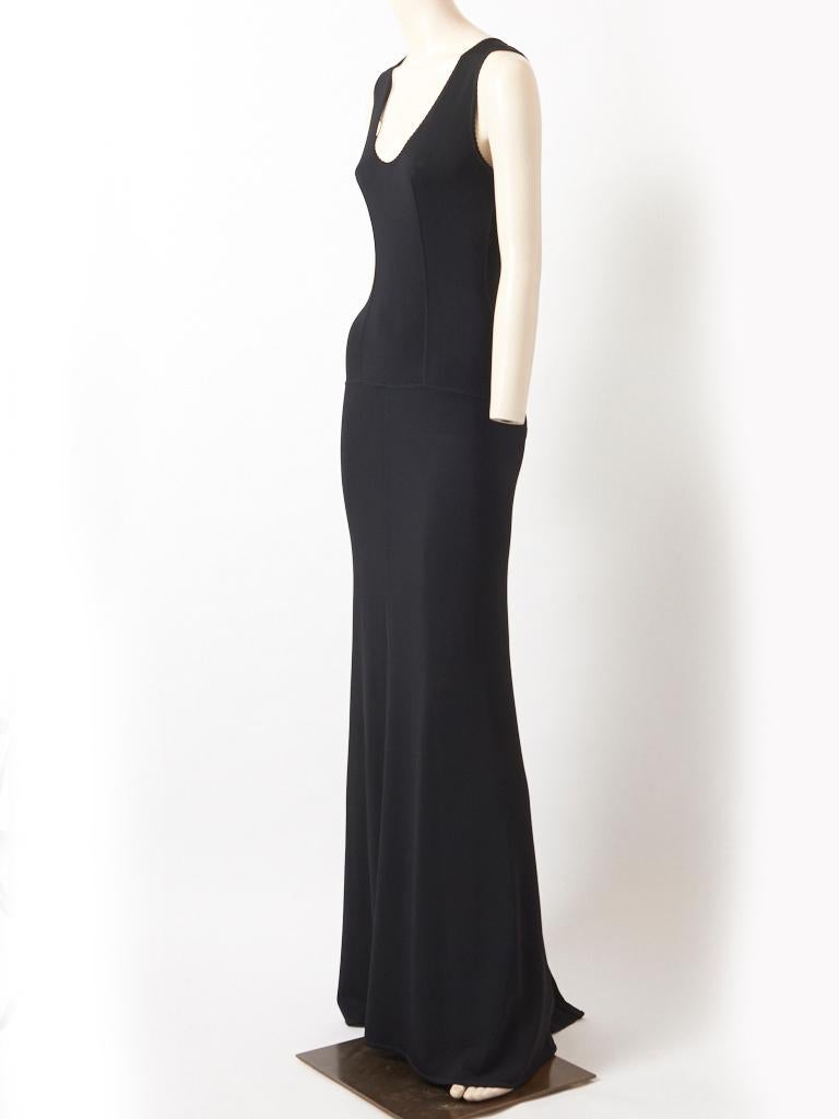Azzedine Alaia, black viscose jersey, sleeveless, long dress, having a fitted bodice, and a deep scoop neckline.