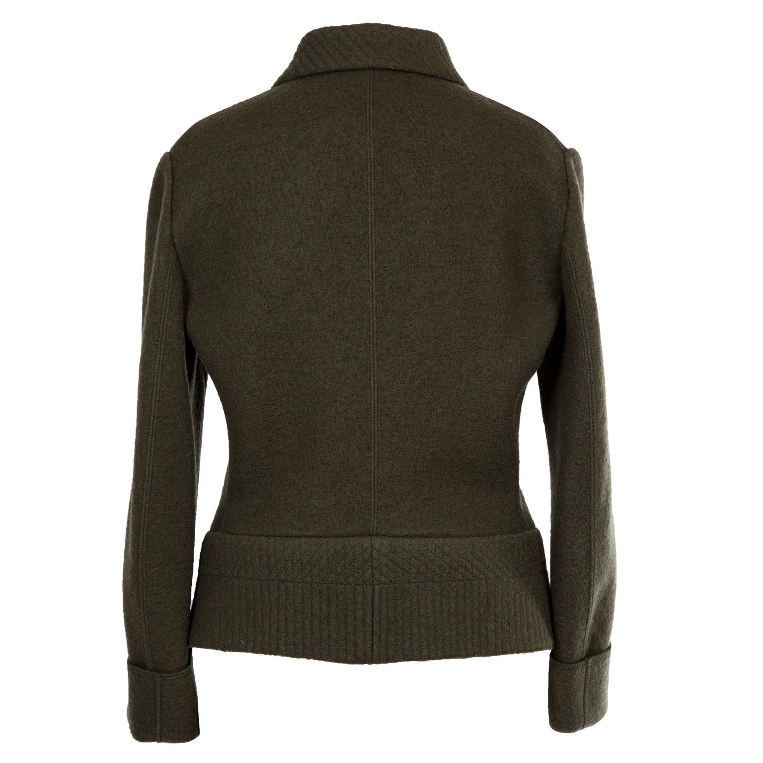 Azzedine Alaia deep khaki wool curved Jacket from 1980's.
With folded cuffs, center front with hidden hook closures, boxy yet iconic Alaia silhouette with stitch details on collar and double faced waist. Very beautifully constructed. 
Original