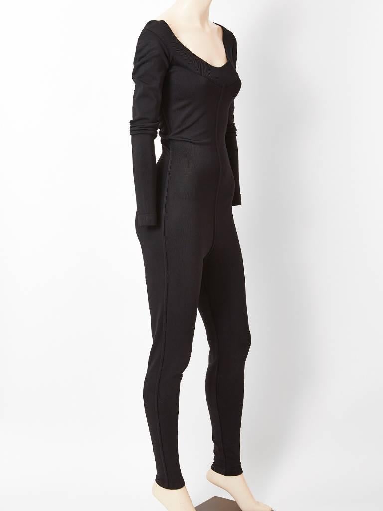 Azzedine Alaïa, jersey knit, scoop neck, catsuit having a center front and back seam detail, long sleeves and a narrow fit leg.