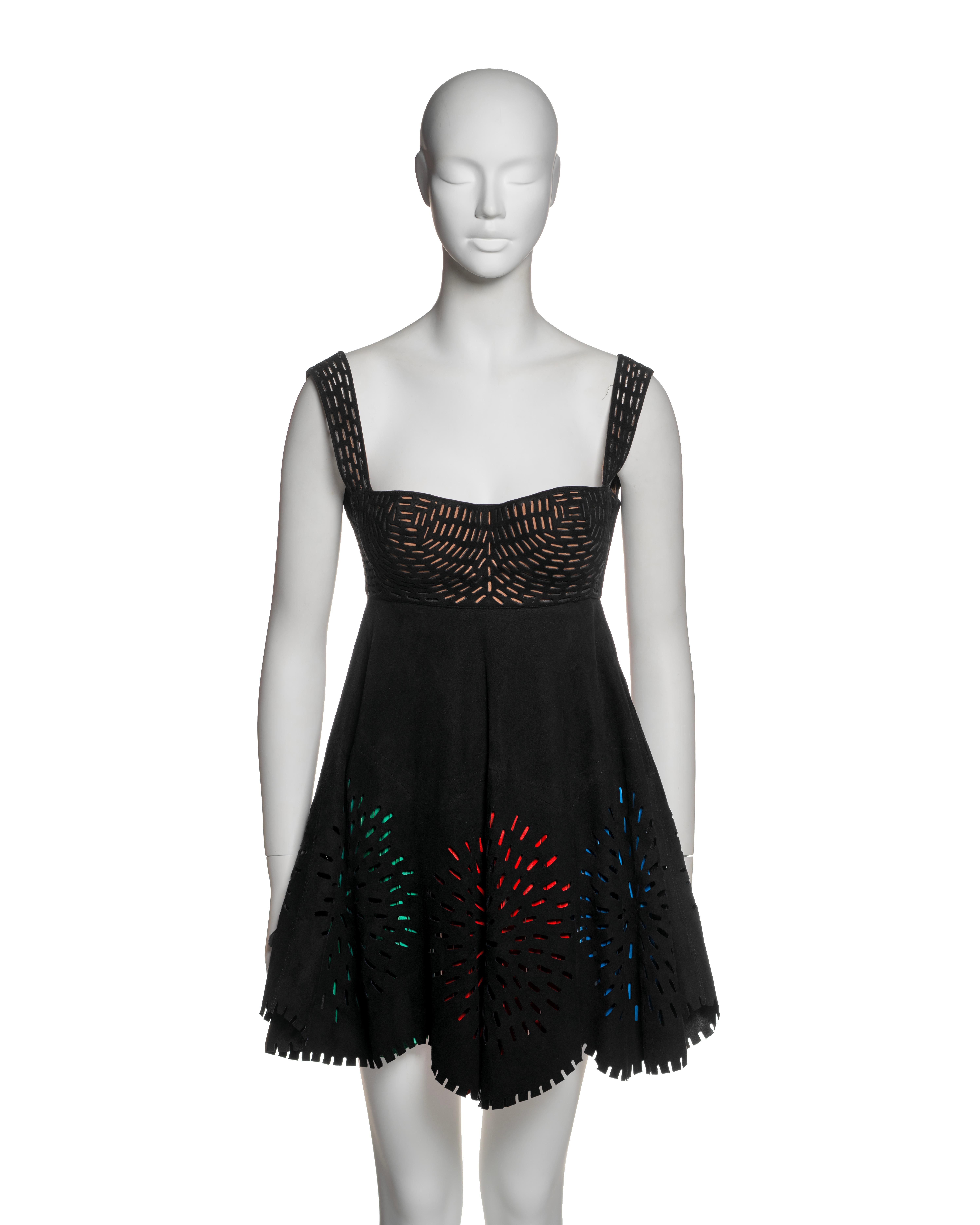 This rare Azzedine Alaïa leather dress from the Spring-Summer 1994 collection exemplifies the designer's precision and innovative craftsmanship. The black laser-cut leather construction reveals intricate geometric patterns on the fitted bustier