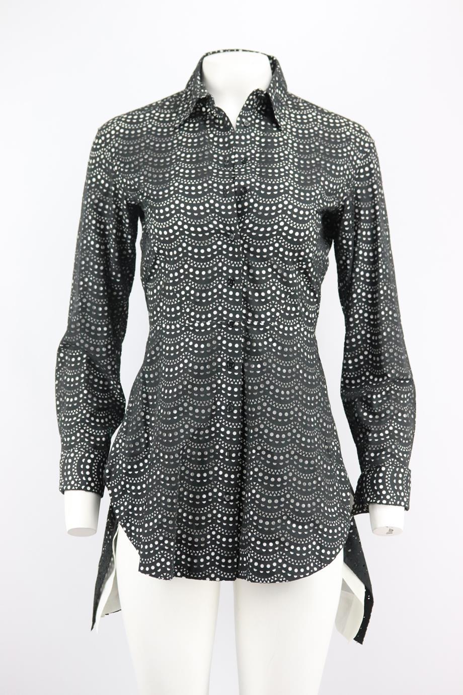 Azzedine Alaïa laser cut cotton blend mini dress. Black and white. Long sleeve, v-neck. Button fastening at front. 65% Cotton, 35% polyester; lining: 100% Cotton. Bust: 32 in. Waist: 26 in. Hips: 36 in. Length: 28 in. Very good condition - No sign