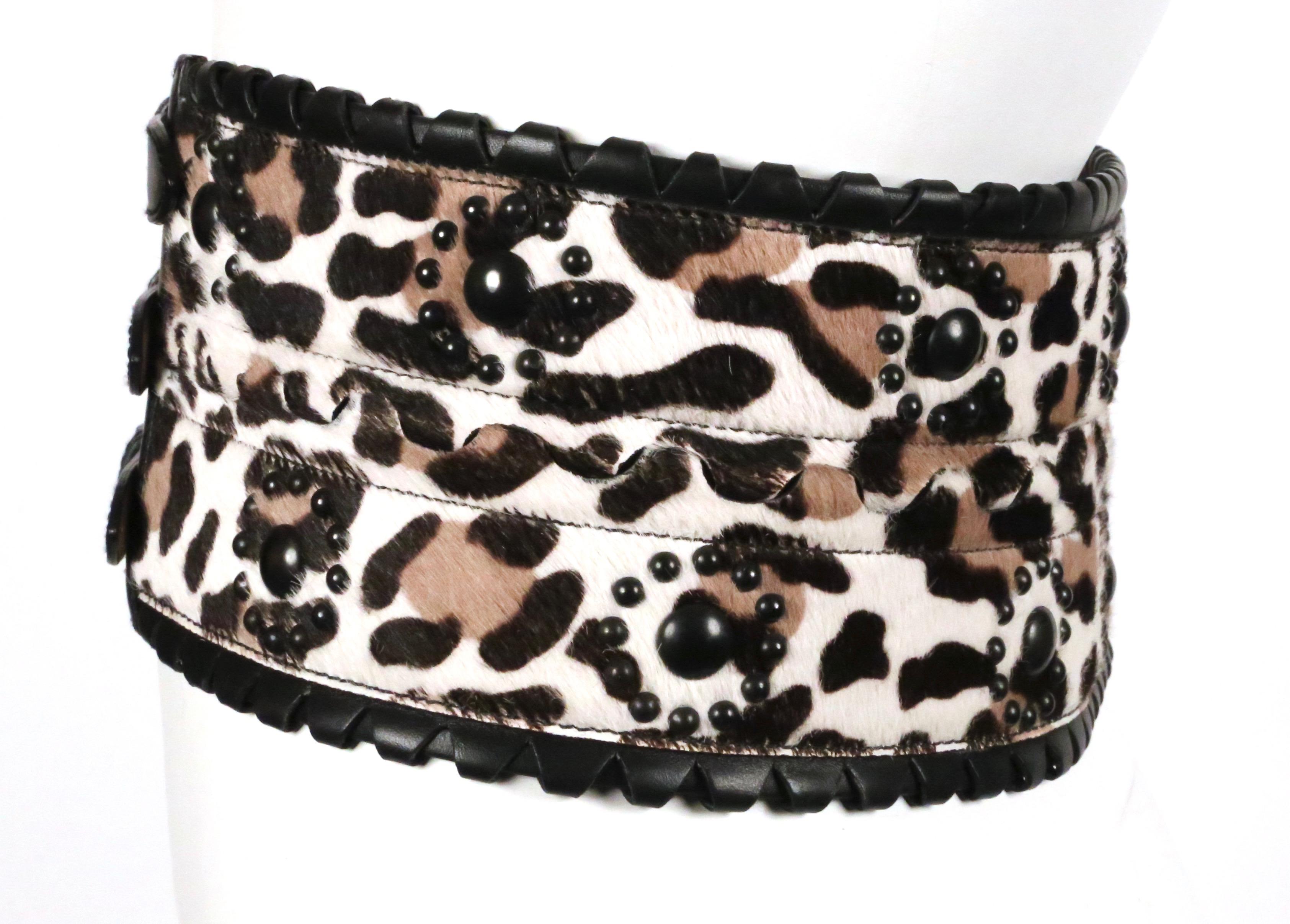 Extra-wide, leopard-printed, calf hair belt with studded detail, triple buckle closure and black leather trim from Azzedine Alaia. French size 80. Belt measures just under 4.75
