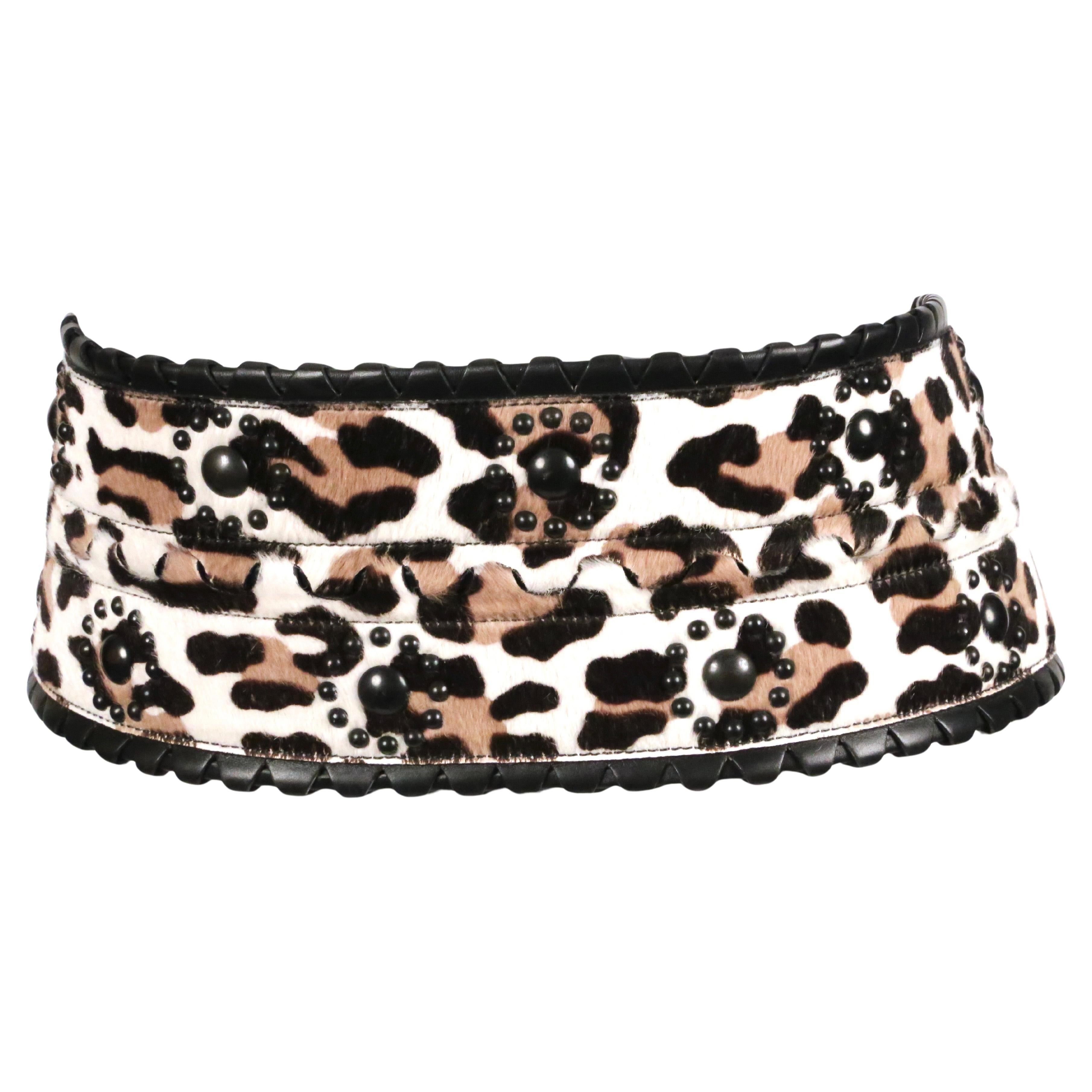 Extra-wide, leopard-printed, calf hair belt with studded detail, triple buckle closure and black leather trim from Azzedine Alaia. French size 80. Belt measures just under 4.75