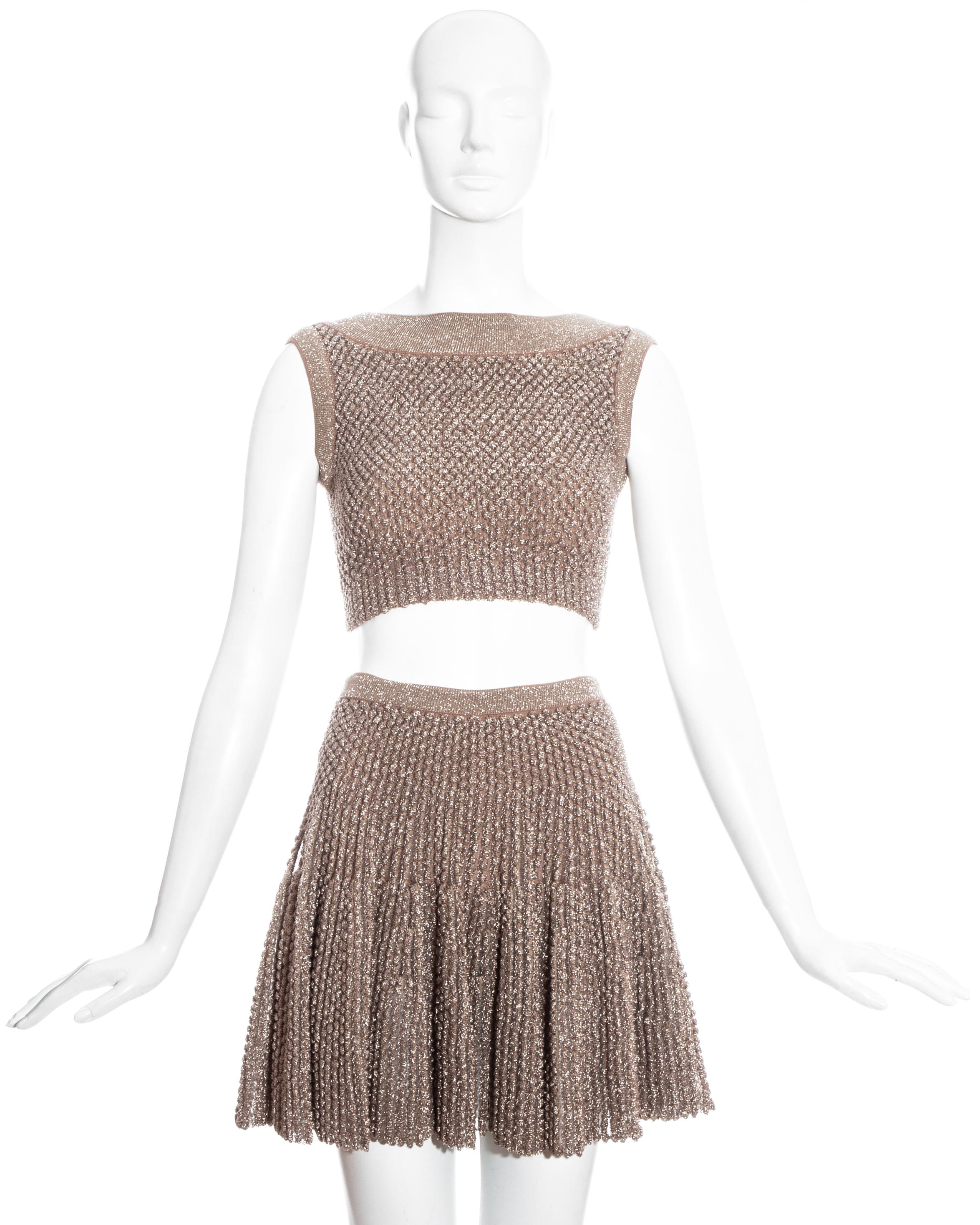 Azzedine Alaia metallic knitted crop top and skater skirt with built-in mini shorts.

Spring-Summer 2015

Measurements:

Top (will stretch)
Shoulder to shoulder 14”
Waist 21”
Bust 27”
Total length 13”

Skirt (will stretch)
Waist 22”
Hips 28”
Total