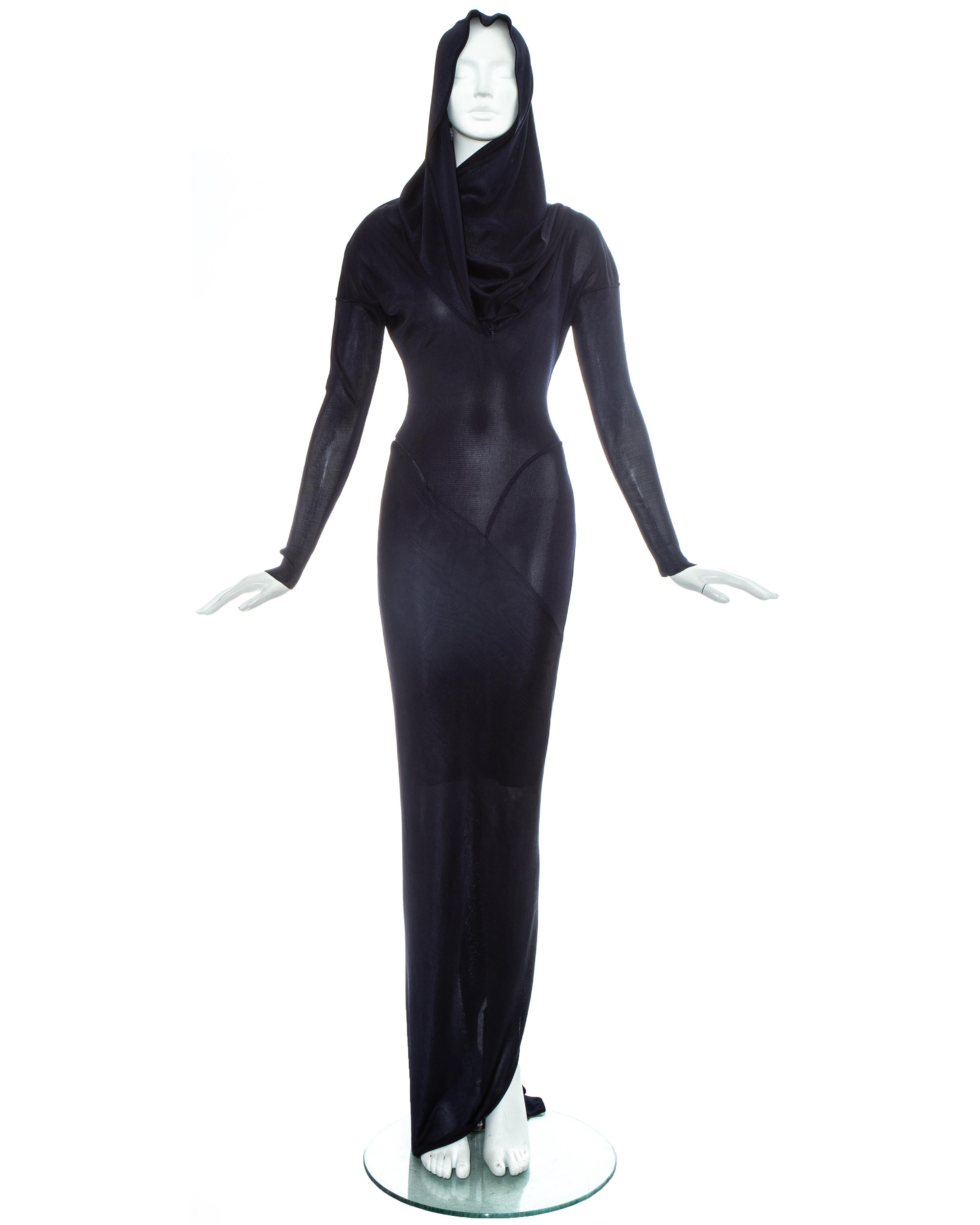 Azzedine Alaia navy acetate bias cut evening dress with signature draped hood, long zip fastening coiled around the body, bias cut panels with flat seams which contour the body and back vent with train.

One of Azzedine Alaia's most iconic and