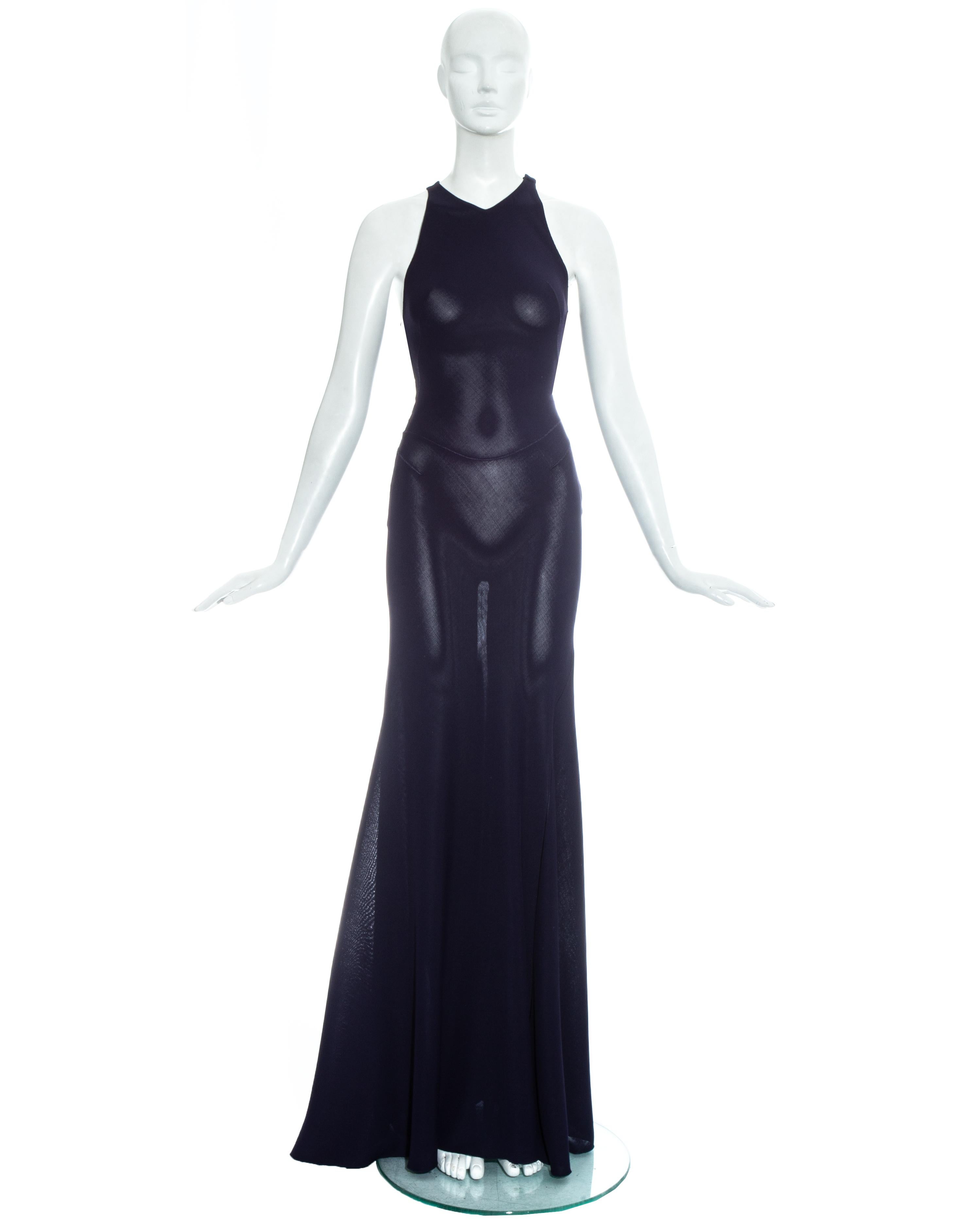 Azzedine Alaia; navy blue knitted rayon maxi dress with body conturing overlocked seams and flared maxi skirt. Invisible zip fastening and two hook and eye closures on shoulder. 

Fall-Winter 2001