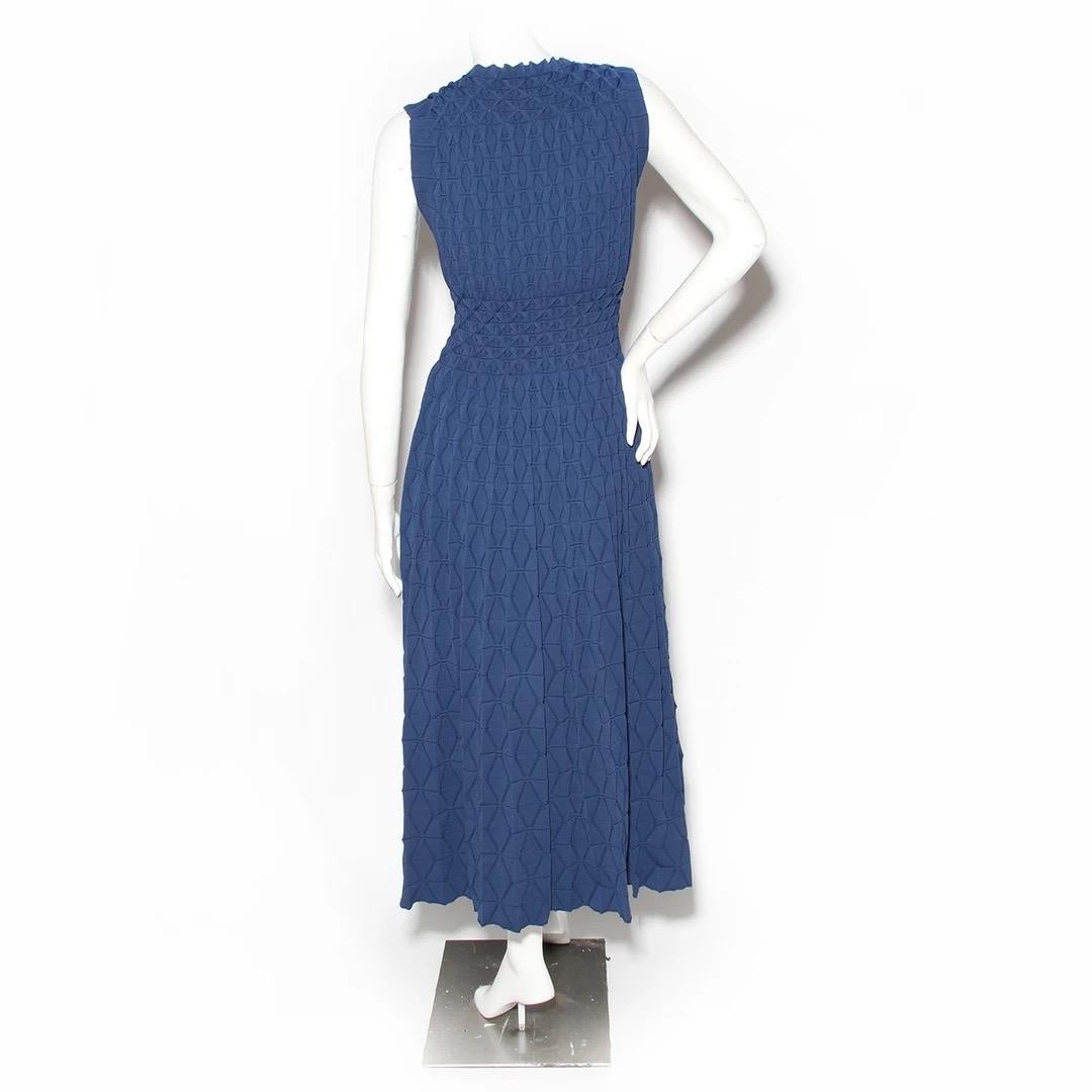 Azzedine Alaïa Dress 
Made in Italy 
Blue knit fabric 
Sculptural 3-D knit at bodice
Geometric print throughout knit fabric of skirt 
Boat neckline  
Full 