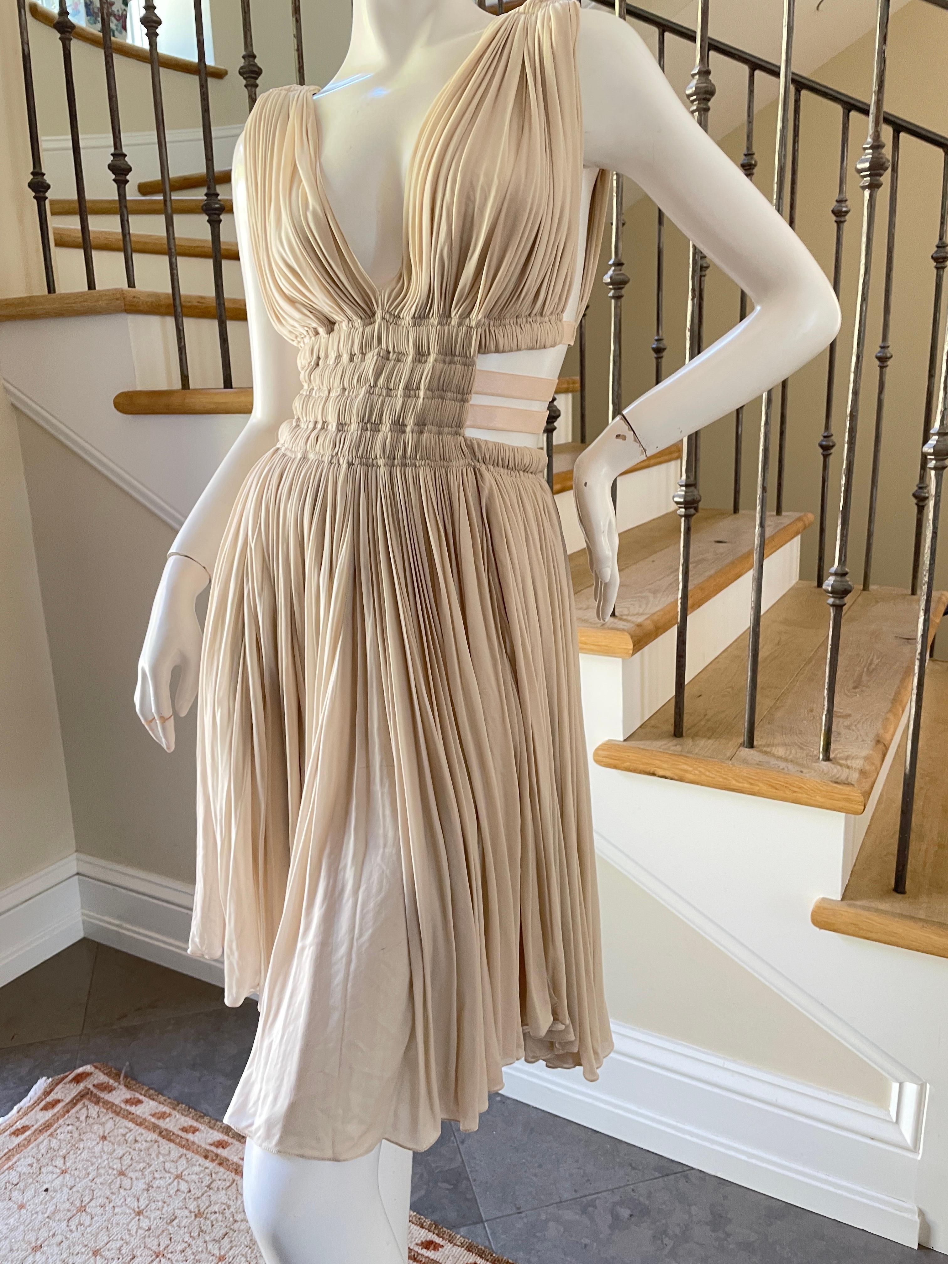 Azzedine Alaia Original Vintage 2004 Pleated Goddess Dress with Side Straps.
One of Alaia's most coveted pieces, this is the vintage, not reissue.
It was reissued by Alaia last year and that one currently retails for $4400
Size 38
 Bust 34