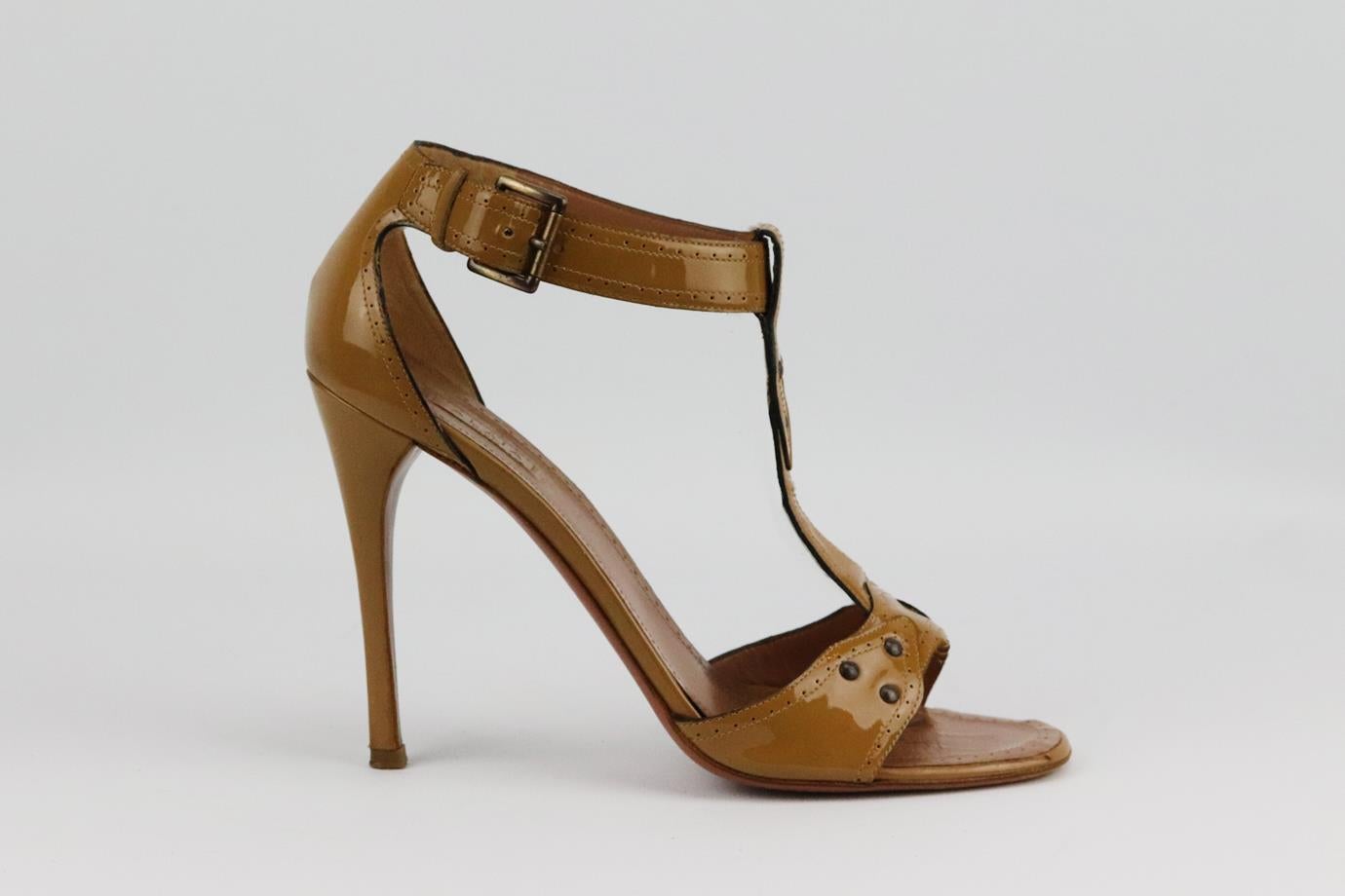 Azzedine Alaïa patent leather sandals. Tan. Buckle fastening at front. Does not come with box or dustbag. Size: EU 39 (UK 6, US 9). Insole: 10 in. Heel: 4 in
