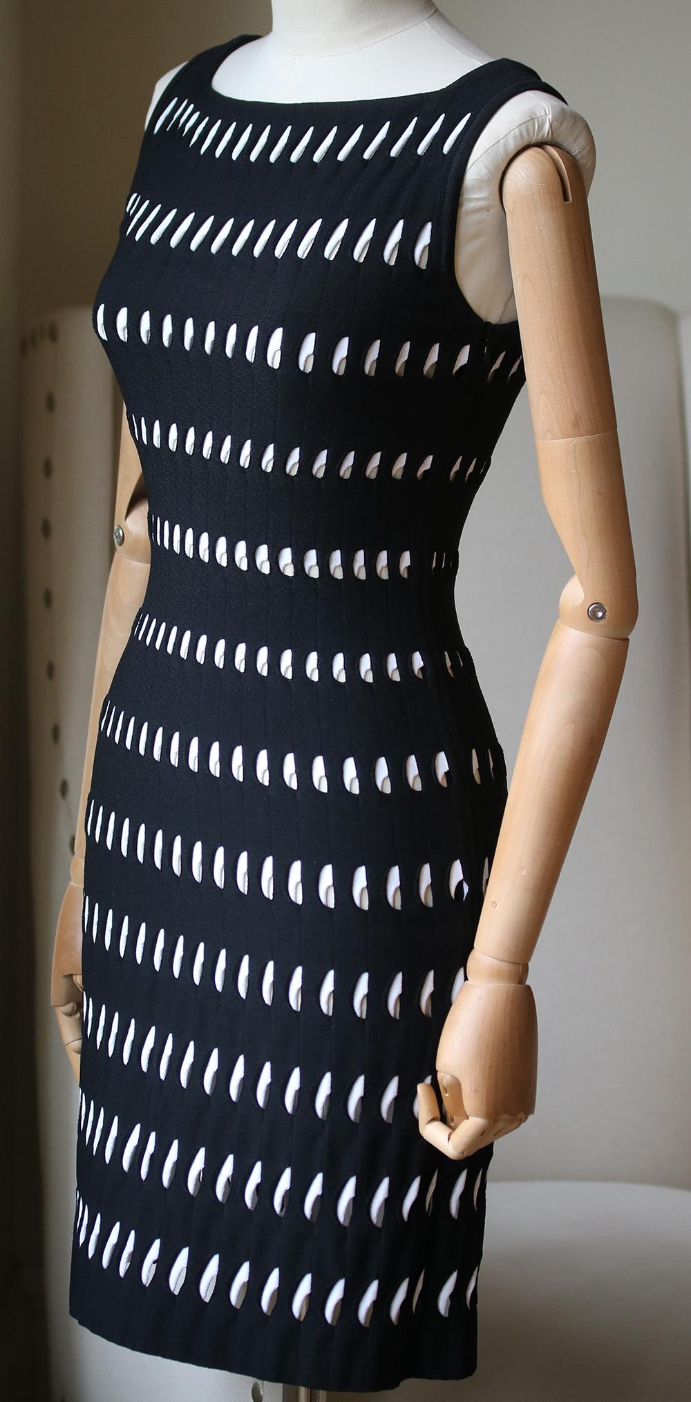Azzedine Alaïa openwork fitted dress. This black and white knit dress is sleeveless with a high square neck. Bodycon fit. 83% Viscose, 17% polyester. Comes up small.

Size: FR 36 (UK 8, US 4, IT 40)

Condition: New with tags 