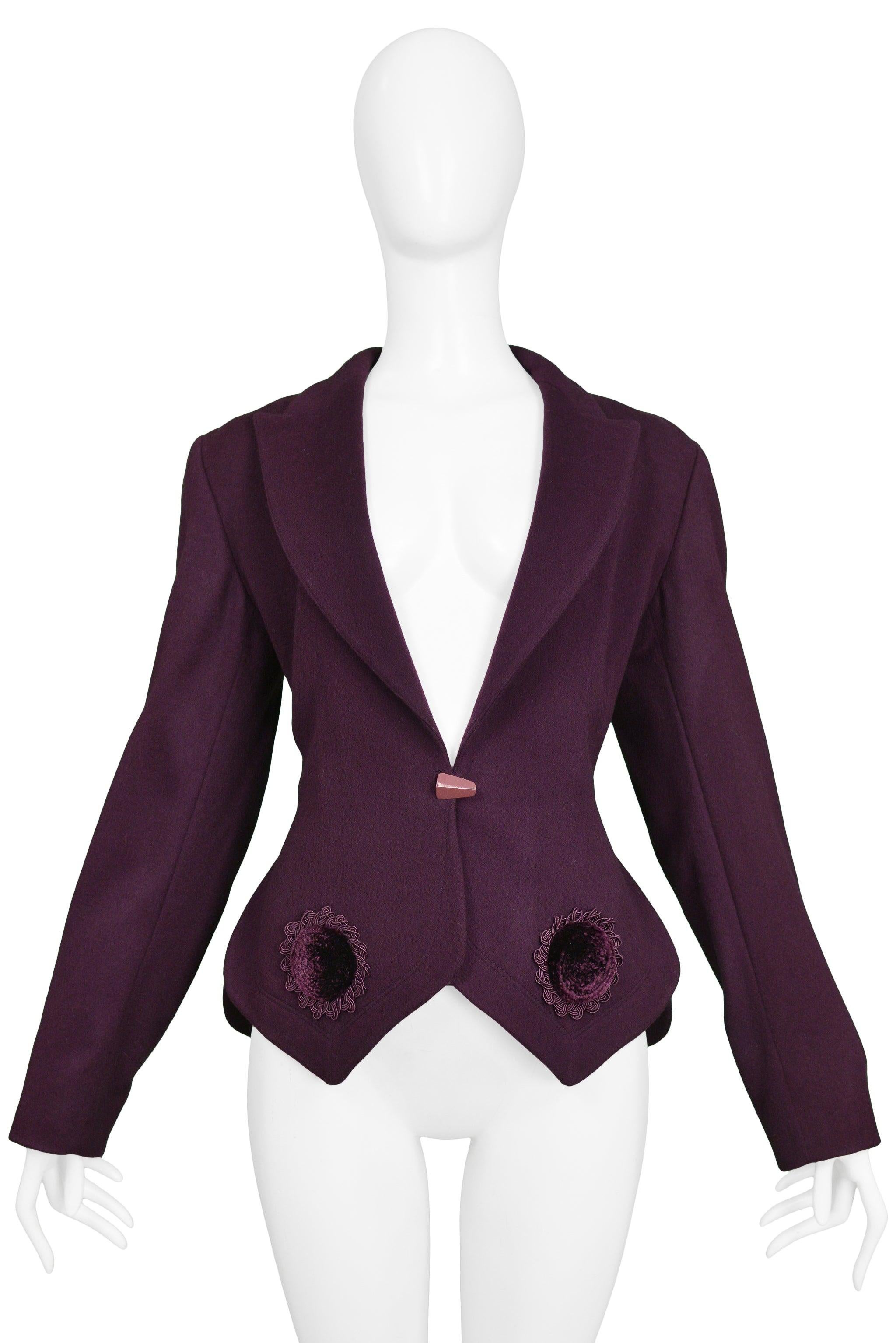 Resurrection Vintage is excited to offer a vintage black Azzedine Alaia wool fitted blazer featuring velvet appliques around the hemline, a classic lapel collar, straight sleeves, a tailored body, and black button closure.

Size 38
Measurements: