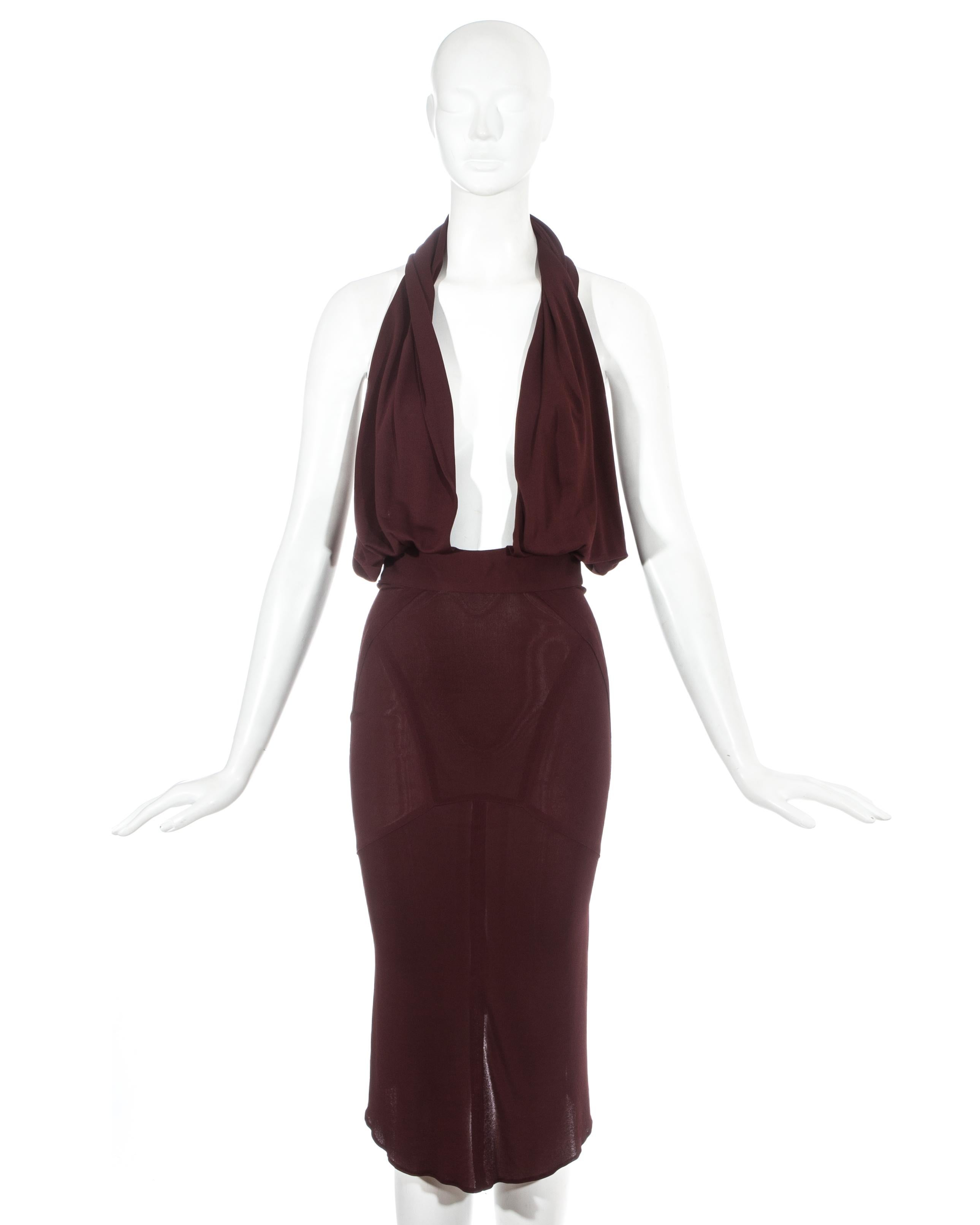 Azzedine Alaia red rayon jersey evening dress with fitted waist and pencil skirt. Attached low cut halter neck collar which could be worn as a hood. 

Spring-Summer 1984
