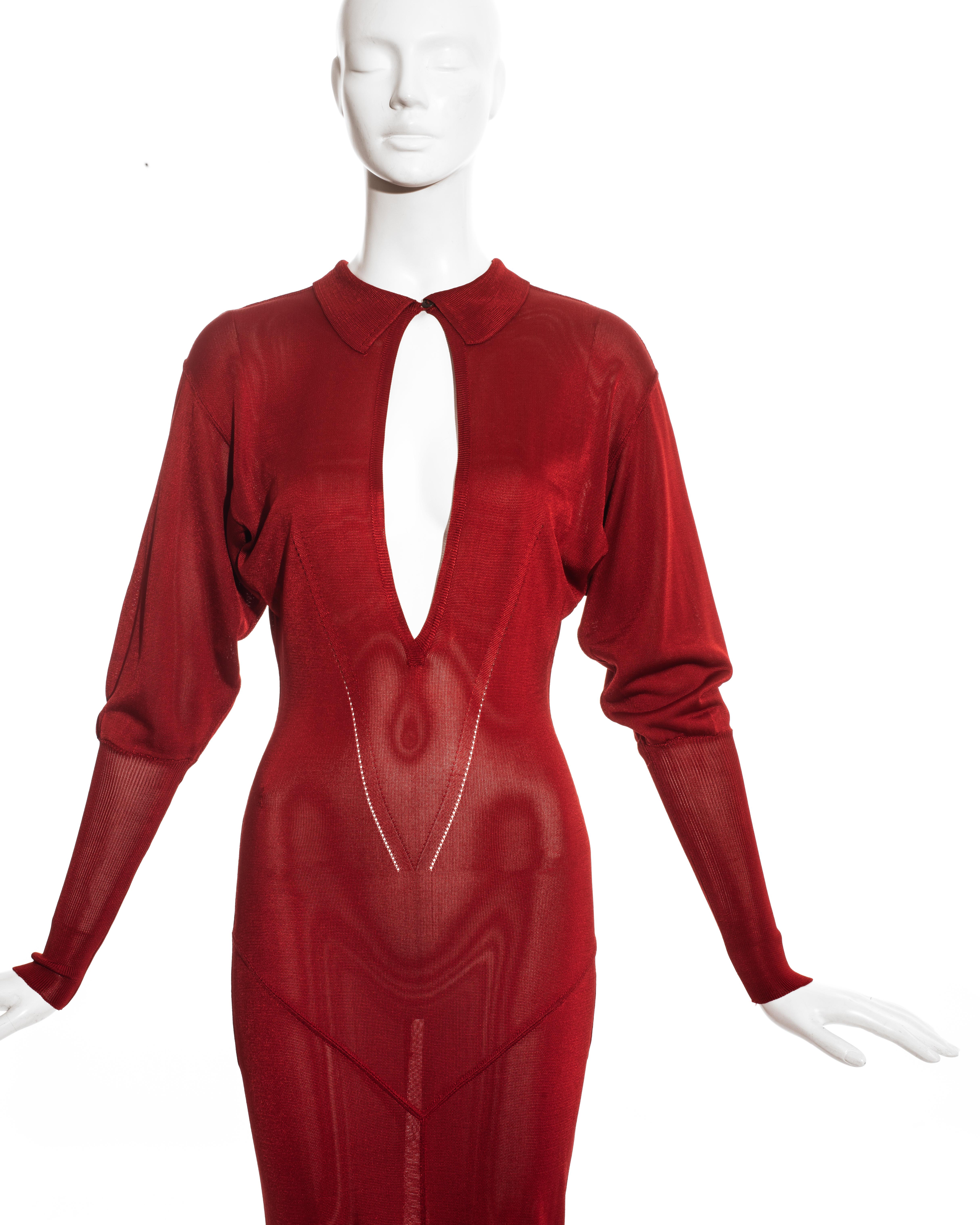 Azzedine Alaia; ruby red acetate knit evening maxi dress with peek-a-boo cleavage, pointed collar, long ribbed cuffs and leg slit at the back. 

Fall-Winter 1986
