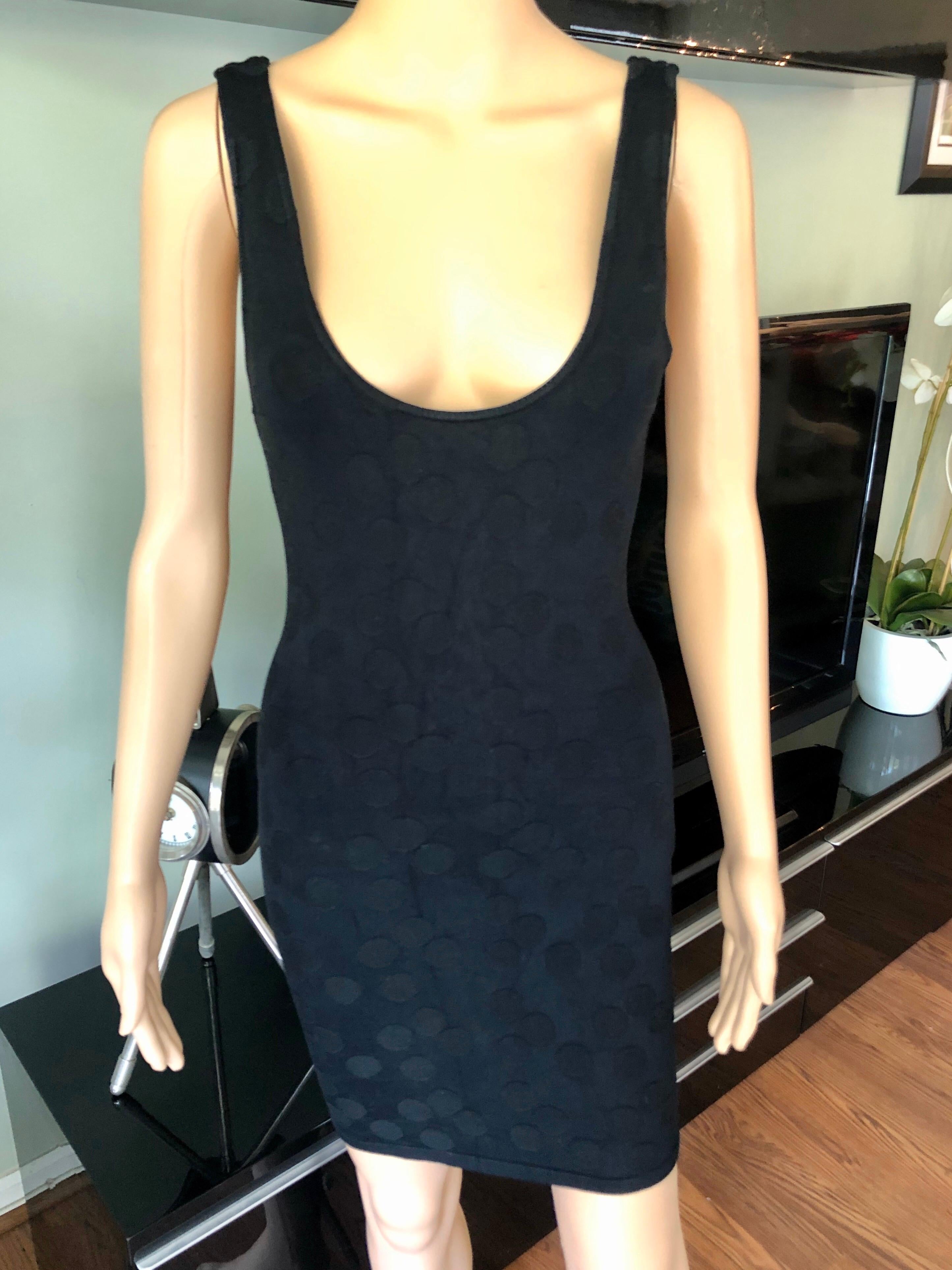 Azzedine Alaia S/S 1991 Vintage Bodycon Open Back Polka Dot Black Mini Dress 

Size L - runs small

Alaïa bodycon mini dress with textured polka dot print throughout, low back and scoop neck.
