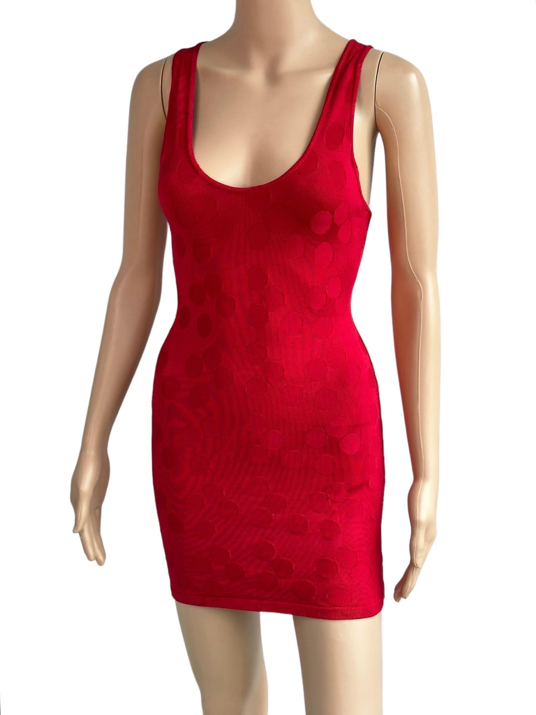 Azzedine Alaia S/S 1991 Vintage Bodycon Open Back Polka Dot Red Mini Dress Size S

Alaïa bodycon mini dress with textured polka dot print throughout, low back and scoop neck.
