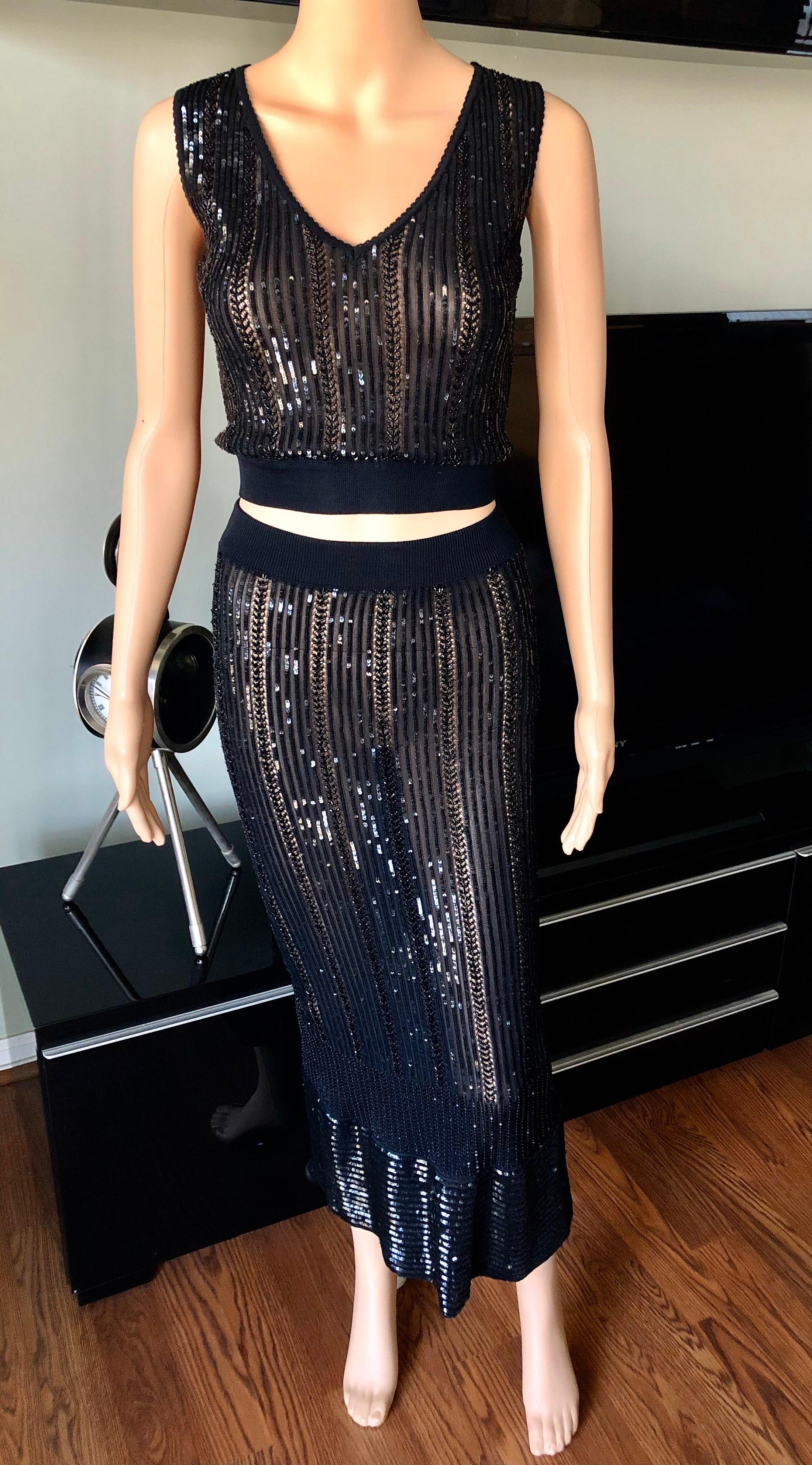 Azzedine Alaia Vintage S/S 1996 Sequin Embellished Black 3 Piece Skirt Set Size XS

Alaïa Vintage black three-piece skirt set with sequin embellishments throughout. Cardigan features V-neck, long sleeves and button-up closures at front. Sleeveless