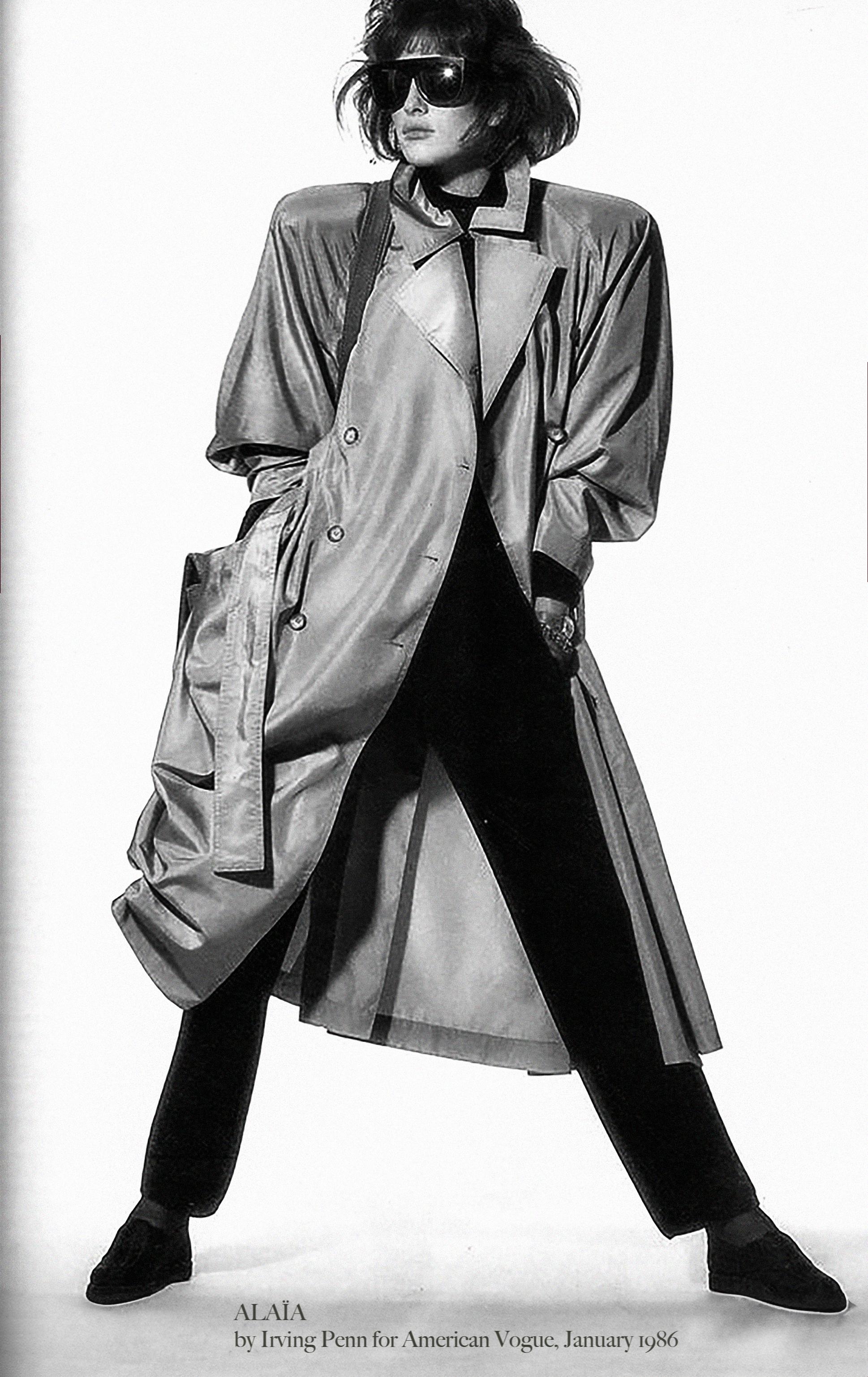 The most gorgeous AZZEDINE ALAÏA trench coat. The perfect jacket for a daily look that is also super luxury and high end. Soft liquid Silk in beautiful pale sage - almost silverish metallic shining colour. Documented: Photographed 1986 by Irving