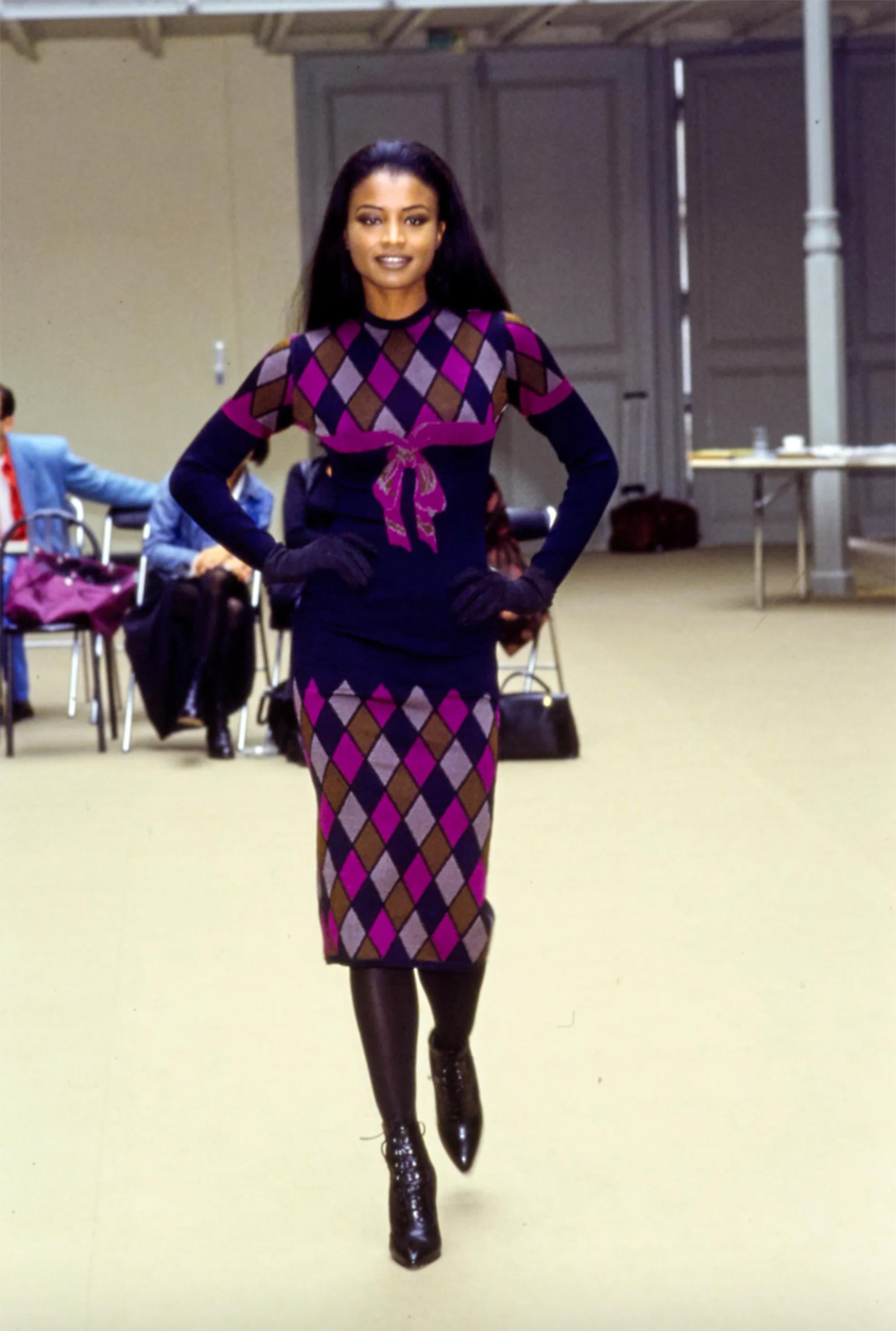 Azzedine Alaïa Fall Winter 1992 Rare Vintage Runway Knit Ribbon Dress

Brand: Alaïa
Designer: Azzedine Alaïa
Collection: Fall / Winter 1992
Fabric: Stretch Viscose Knit
Color: Navy with pink and brown
Size: XS

Azzedine Alaïa gained his reputation