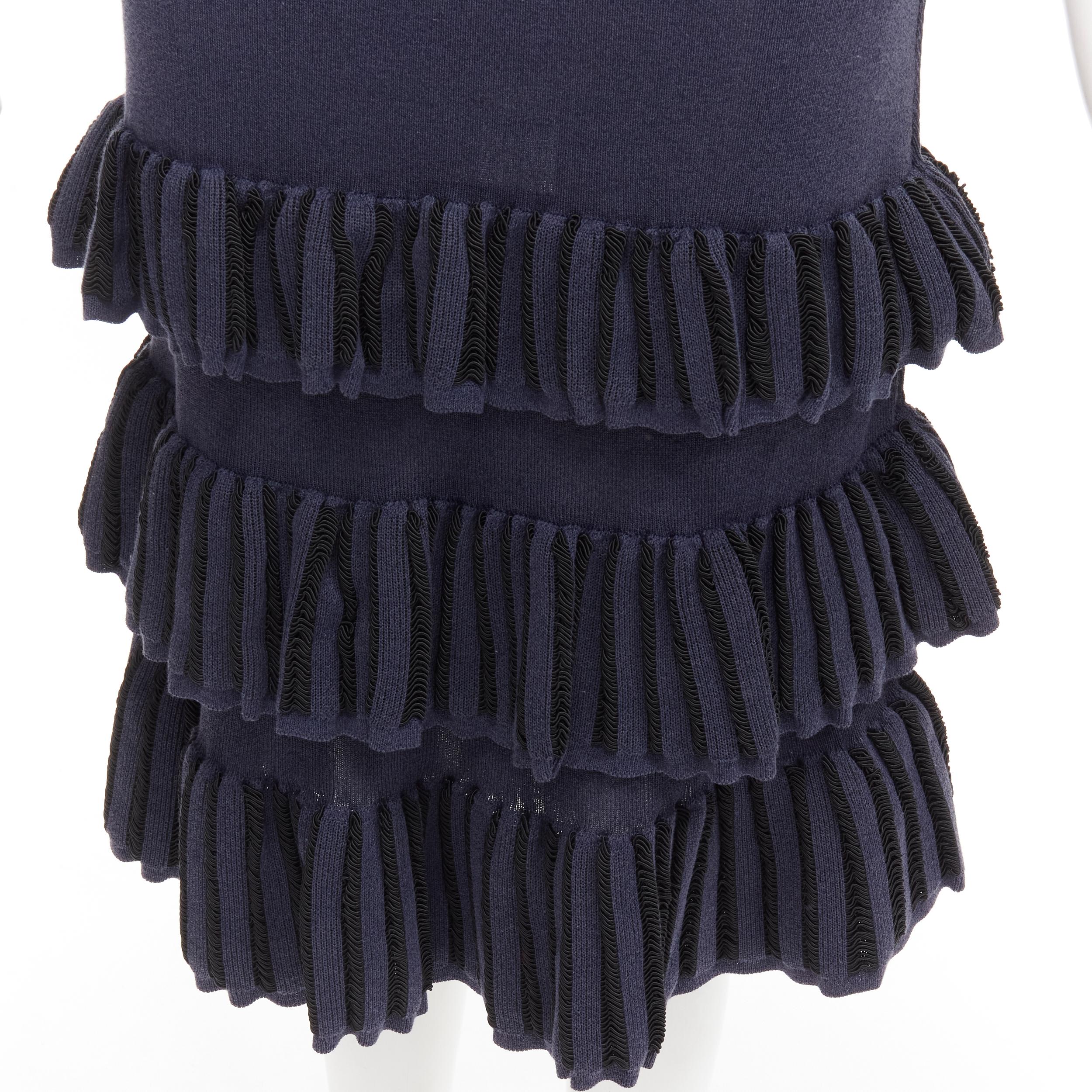 AZZEDINE ALAIA Vintage 1980's navy knitted tiered ruffles plunge neck dress
Reference: TGAS/C01665
Brand: Alaia
Designer: Azzedine Alaia
Collection: 1980s
Material: Feels like cotton
Color: Navy
Pattern: Solid
Closure: Pullover
Extra Details: Loop