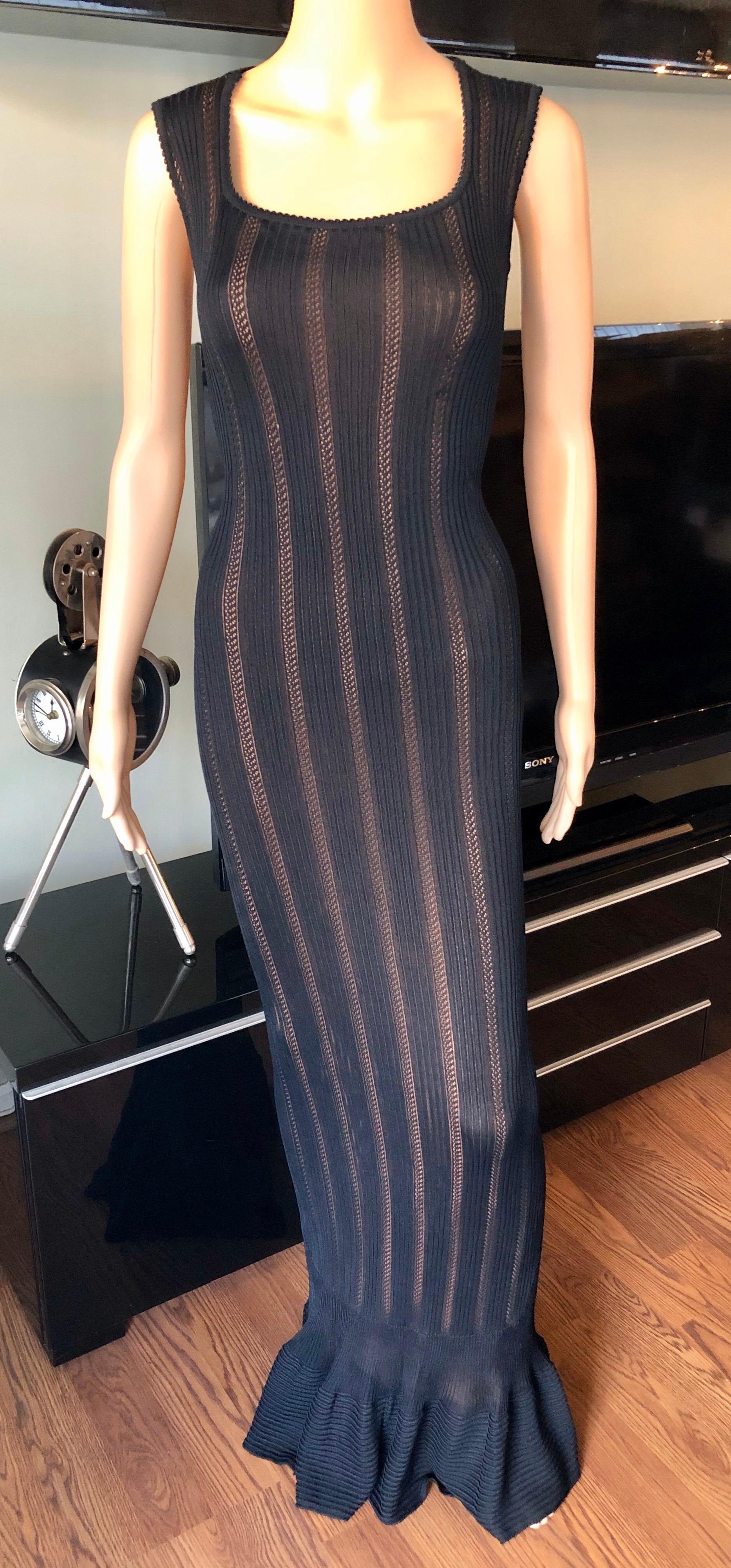 Azzedine Alaia Vintage 1990's Knit Bodycon Black Dress Gown Size M

Alaïa knit semi sheer sleeveless knit maxi dress with nude slip, scoop neck and zip closure at back.