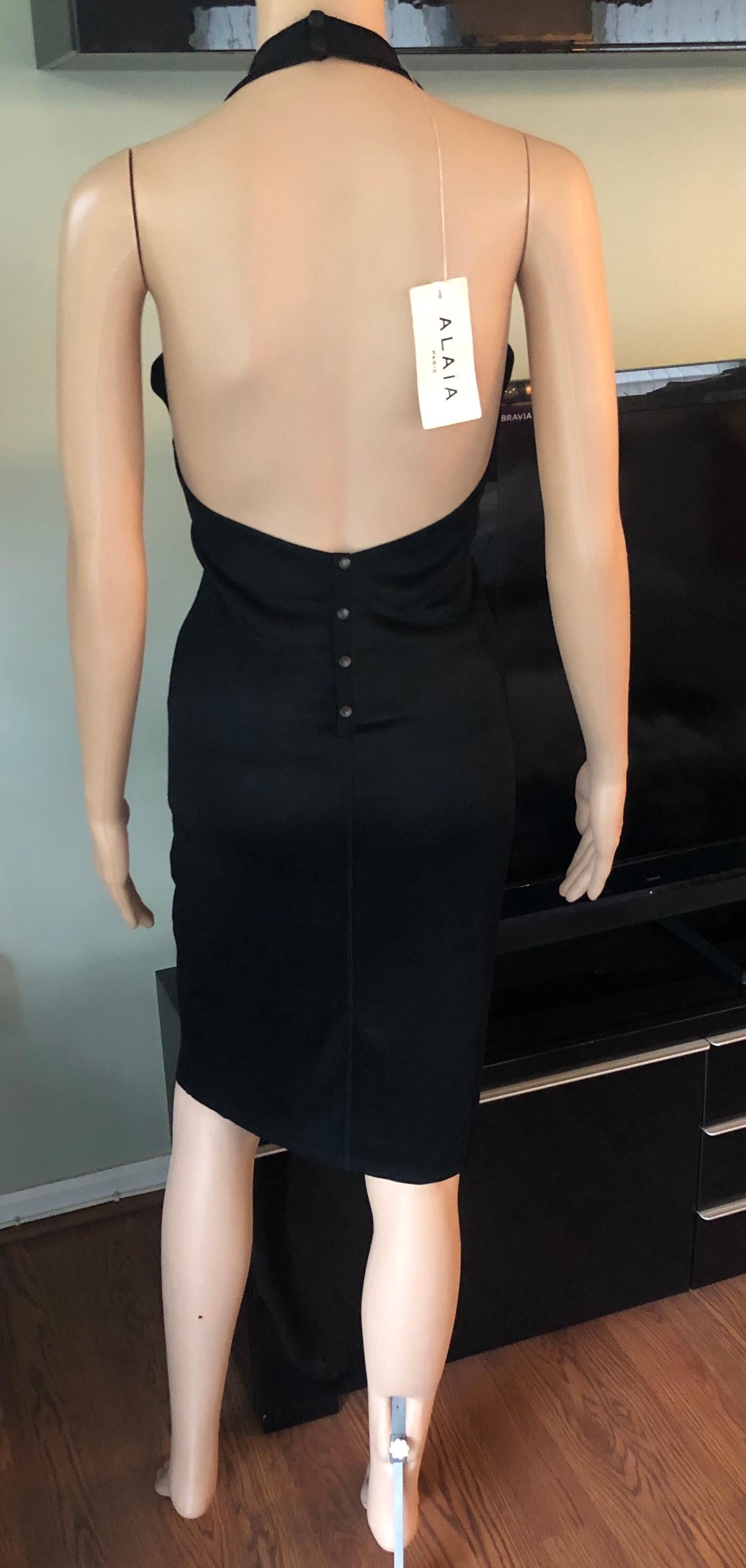 Azzedine Alaia Vintage Bodycon Halter Backless Black Dress Size L

Alaïa fitted halter black dress with scoop neck, open back and snap closures at nape and center back.
