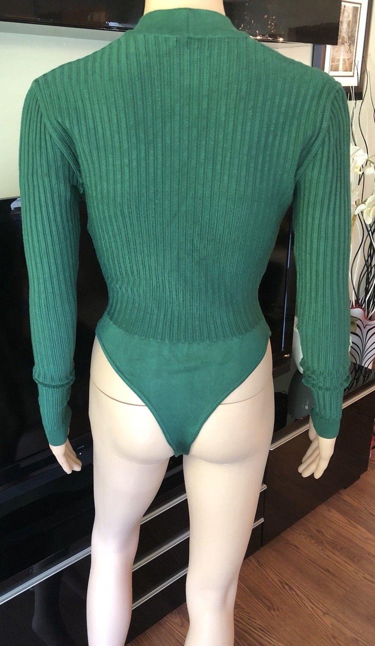 Azzedine Alaia Vintage Sexy Plunging Neckline Rib Knit Bodysuit Size M

Alaïa knit bodysuit with long sleeves, rib knit trim, button closures at front and snap closures at hem.

All Eyes on Alaïa

For the last half-century, the world’s most