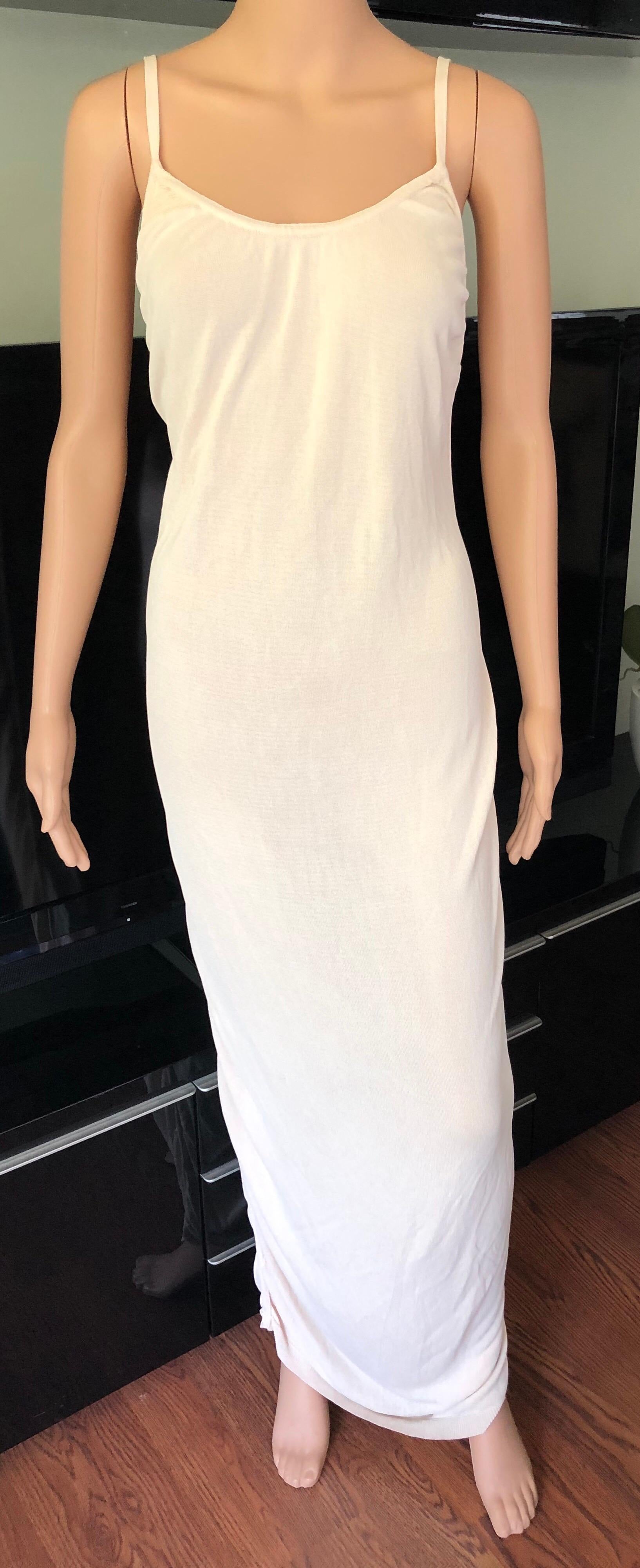 Azzedine Alaia Vintage Dress Gown S/M

Creme Alaïa sleeveless ruched open back dress with tonal stitching throughout and scoop neck.Please note fabric and size tags have been removed.

All Eyes on Alaïa

For the last half-century, the world’s most