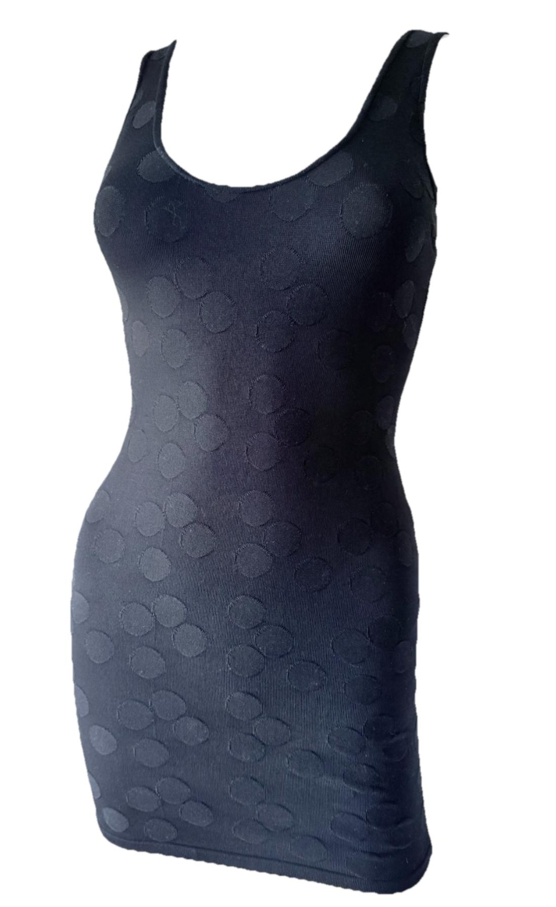From Alaïa’s iconic Spring/Summer 1991 collection, this body-hugging mini dress features the house’s signature sculpted silhouette and a tonal embroidered polka dot motif—a detail memorably seen on the runway.

• Archival piece – Spring/Summer
