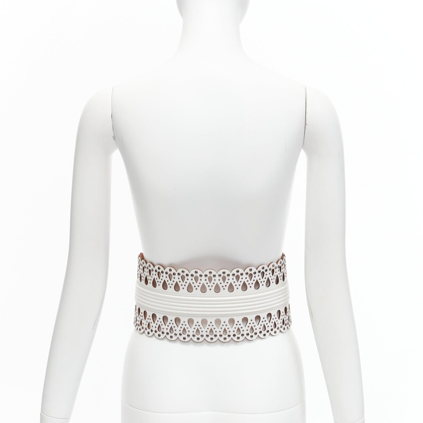 Women's AZZEDINE ALAIA white laser cut studded leather corset waist belt 70cm For Sale