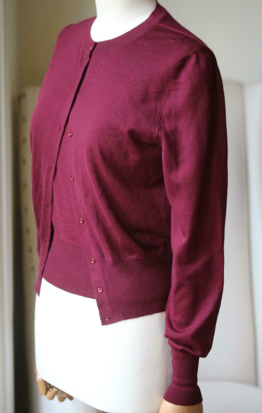 This cardigan and top set is spun from luxuriously soft wool in a semi-cropped silhouette that highlights your slimmest point. Burgundy wool. Button fastenings down the front. 100% wool. Colour: Burgundy. Made in Italy.

Size: FR 40 (UK 12, US 8, IT