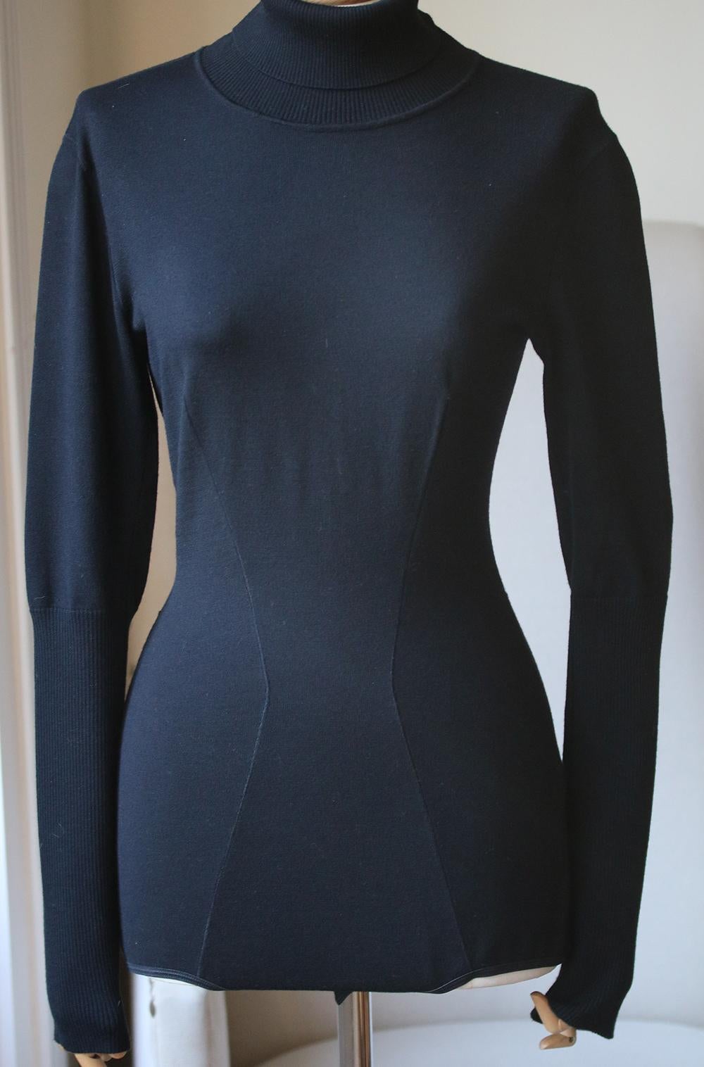 Bodysuits make a whole outfit look so sleek and elegantly pulled together. Cut with a full covered base, this Alaïa style works as well with something tight-fitting as it does with a looser, more fluid skirt as seen here. It's spun from beautifully