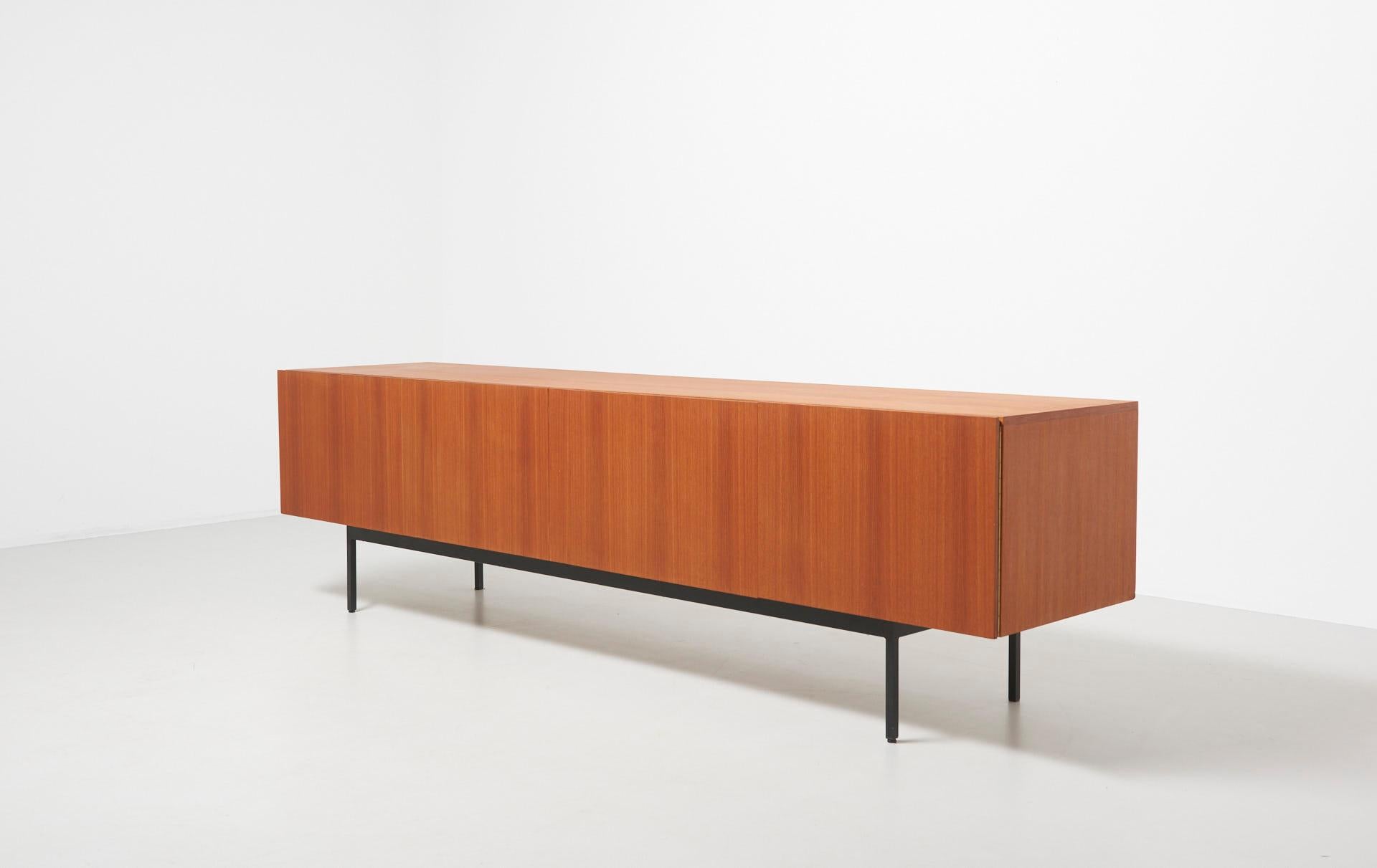 B-40 sideboard in teak with black metal frame. Drawers and a mobile beverage cart in maple.
Designed by Dieter Waeckerlin in 1958.
Produced by Behr in Germany.