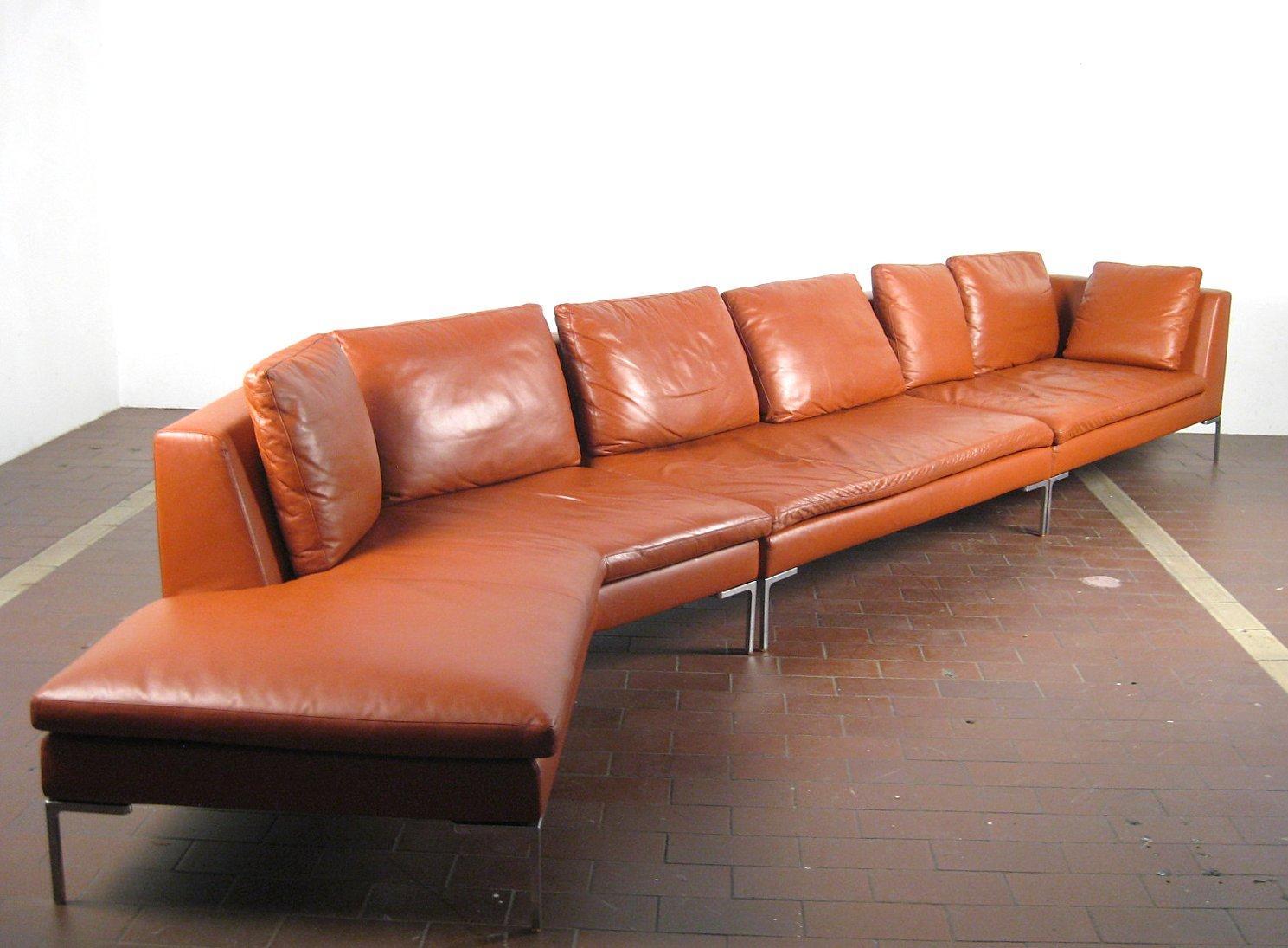 A large L shaped B&B Italia modular sofa, upholstered in soft tan leather, with polished aluminum feet. The sofa can be configured into different shapes to suit the room and your mood.
The leather is soft and supple, almost-new in condition with no