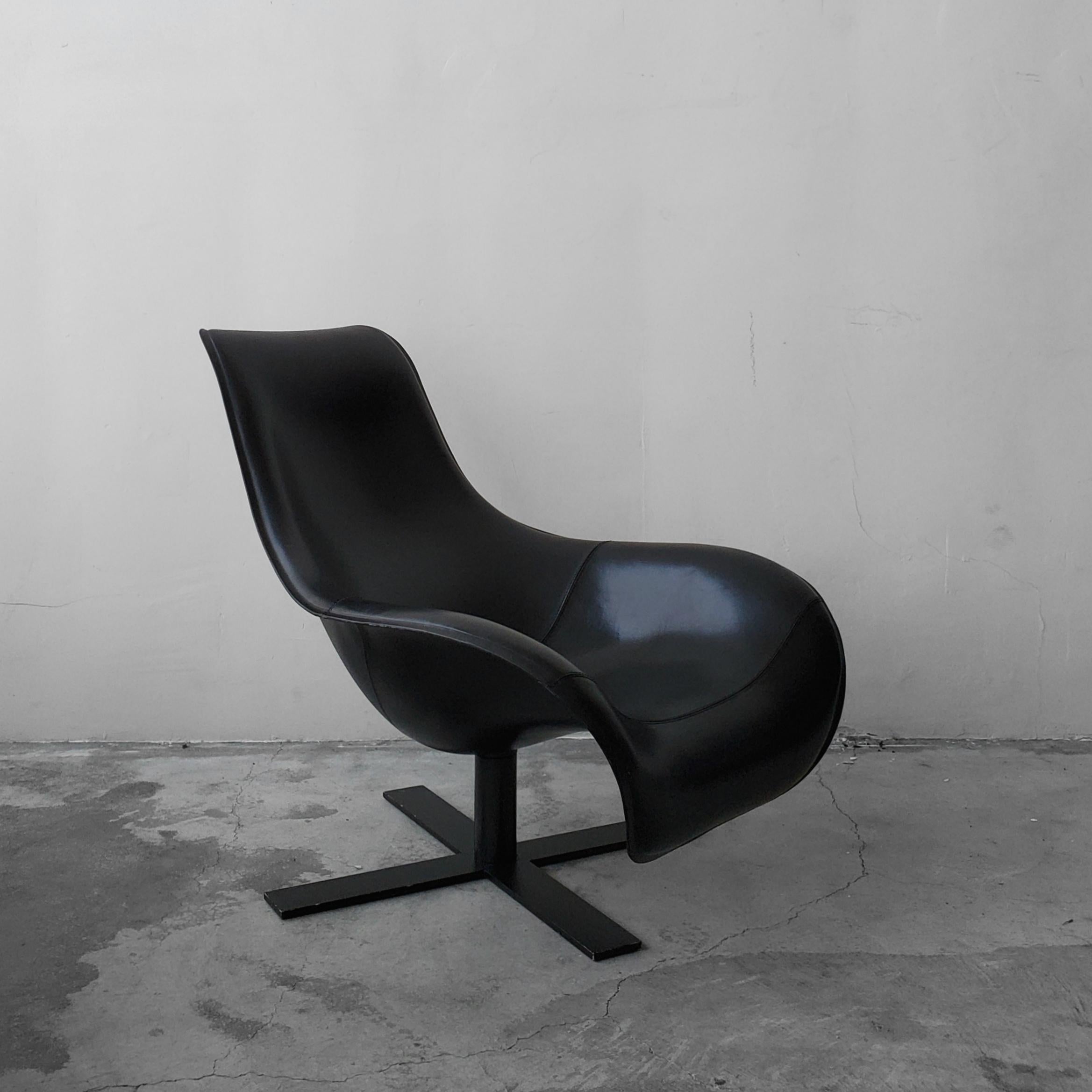 An all-black, B & B Italia Mart swivel armchair in thermoformed black leather design by Antonio Citterio. The chair that just looks like relaxation. A modern piece, yet Classic enough to mesh with all decors.

Chair is in excellent condition
