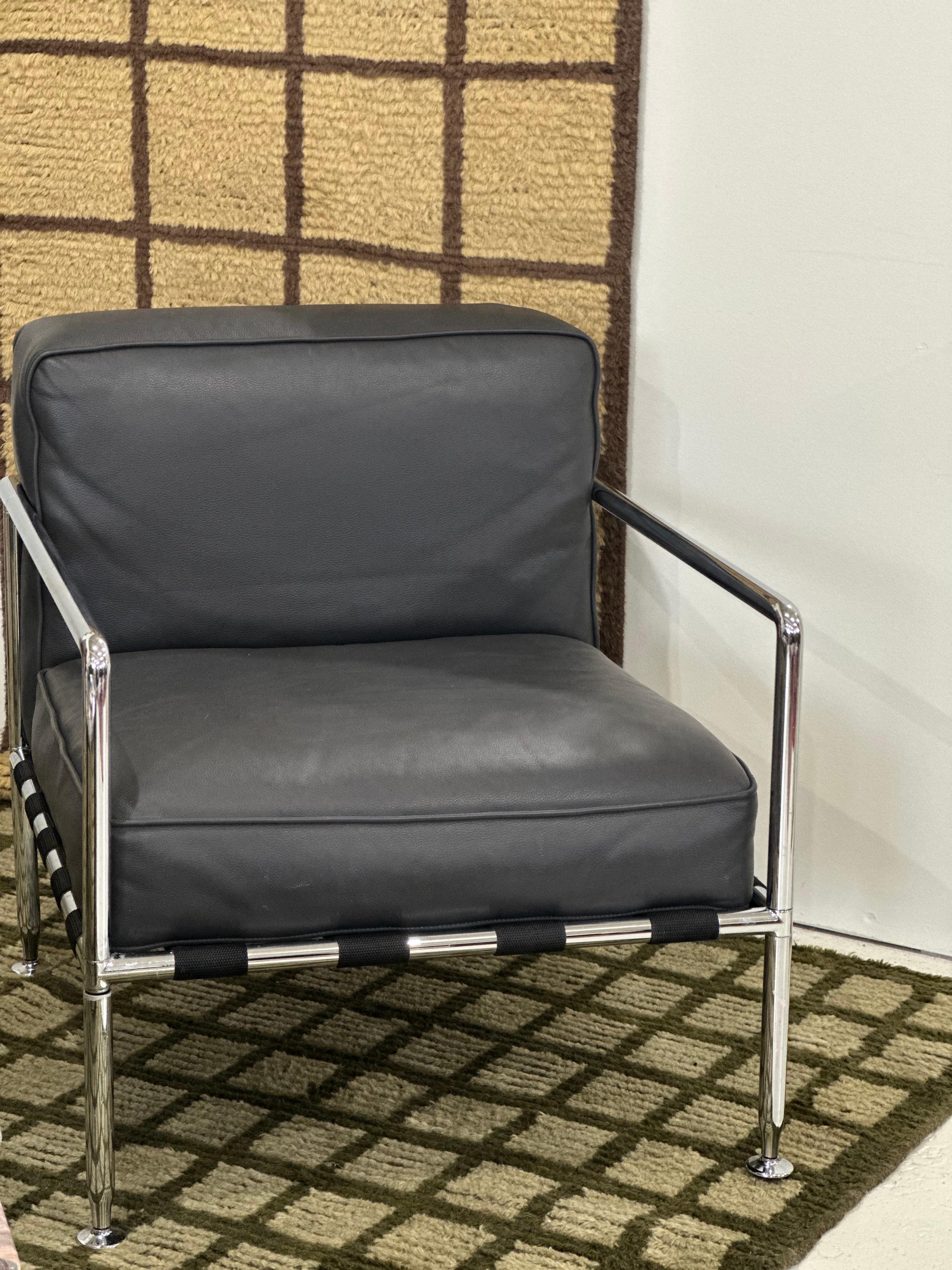 Gray leather B&B Italia club chair with chrome-plated frame. In excellent condition with minimal, if any, signs of age-related wear. 