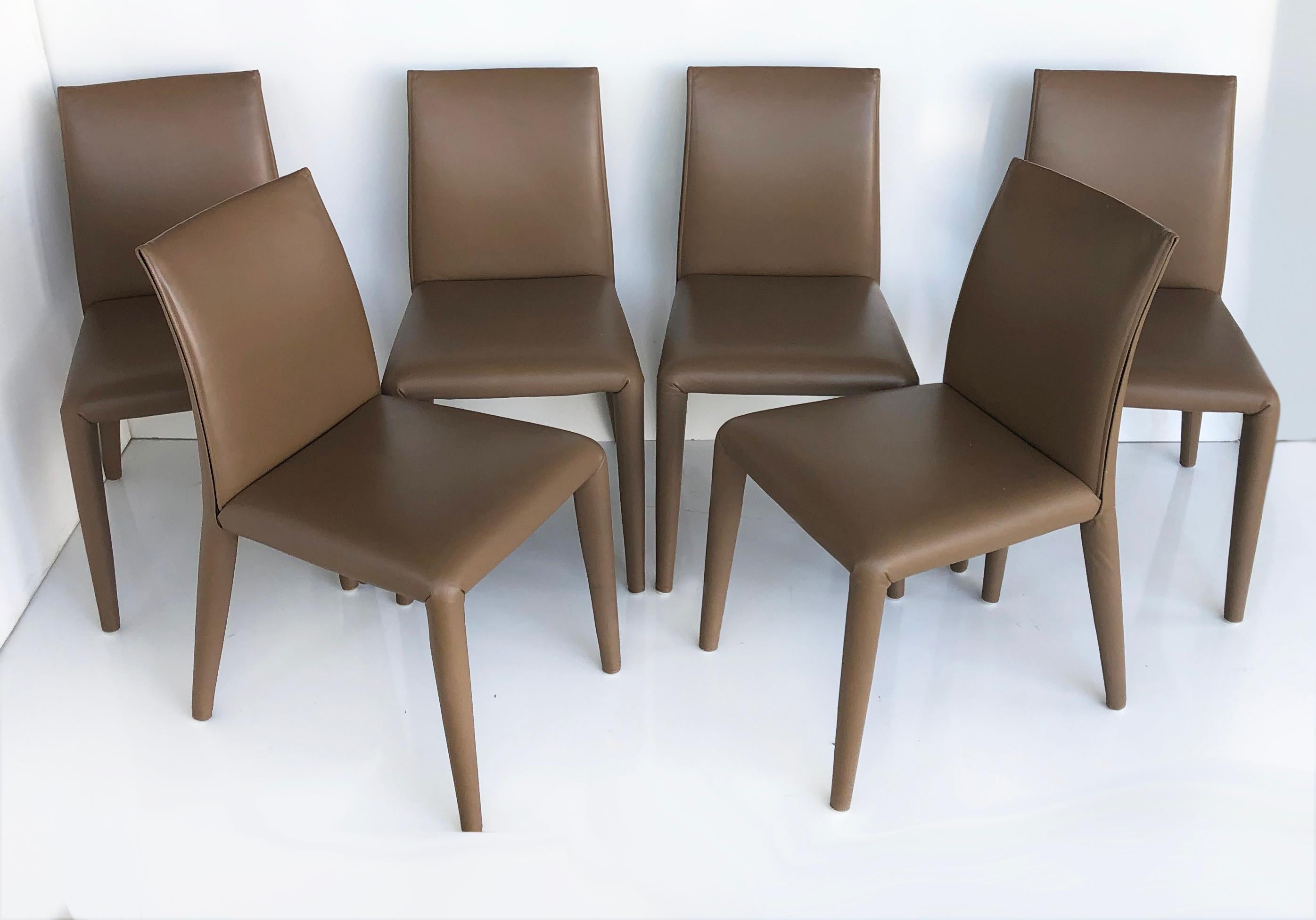B & B Italia Mario Bellini Vol Au Vent Leather Dining Chairs, Set of 6

Offered for sale is a set of six fine quality B & B Italia Vol Au Vent leather side chairs designed by Mario Bellini. The set is in excellent vintage condition. The previous