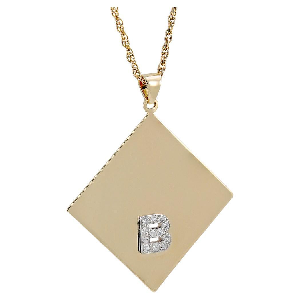 B Pendentif en or et diamants avec motif « Dead ou Alive » en vente